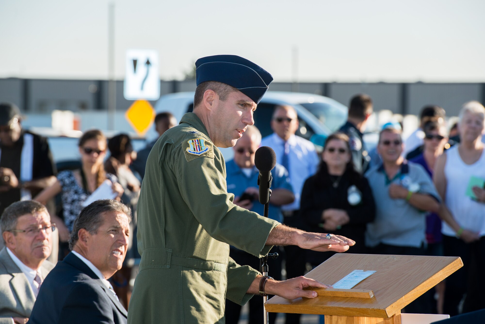 U.S. Air Force Col. John Klein, 60th Air Mobility Wing commander, at Travis Air Force Base, Calif., provides remarks during the Peabody Road reopening ceremony in Fairfield, Calif., Aug. 4, 2016. The road was closed for 14-months and finished ten days ahead of schedule. Peabody Road is a major thoroughfare that connects the cities of Vacaville and Fairfield, more than 20,000 vehicles per day use the road and it is also a major artery into Travis Air Force Base for more than 14,000 employees. The construction of the Peabody Road overpass is part of the new Fairfield-Vacaville train station project along the Capitol Corridor. (U.S. Air Force photo by Louis Briscese) 
