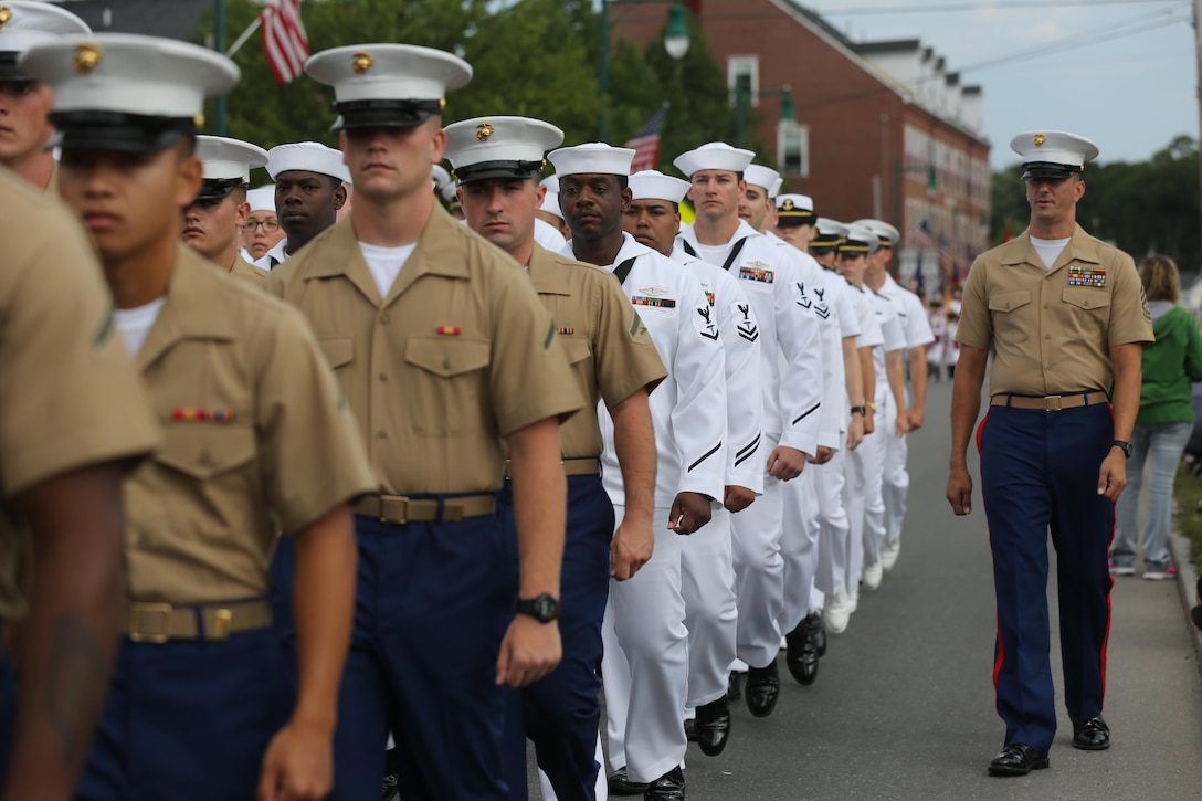 Gunnery Sgt. Joshua Pendley, a motor transport chief with Combat Logistics Battalion 8, 2nd Marine Logistics Group, calls cadence for a formation in a parade during Lobster Fest in Rockland, ME, Aug. 3-7, 2016. The Marines and sailors aboard the USS Oak Hill (LSD-51) were in port to participate in the festival and display the expeditionary capabilities of the Navy-Marine Corps team. (U.S. Marine Corps photo by Sgt. Olivia McDonald)