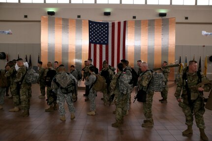 Soldiers with Headquarters and Headquarters Company, 96th Military Police Battalion, U.S. Army Reserve are weighed, manifested and processed prior to boarding a flight at the Silas L. Copeland Arrival/Departure Airfield Control Group here July 20.