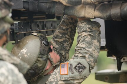 U.S. Army Reserve Sgt. Daniel Caldwell, from the 739th Engineer Company, attached to the 652nd Engineering Company, Hammond, Wis., prepares a dry support bridge launch vehicle during Combat Support Training Exercise (CSTX) 86-16-03 at Fort McCoy, Wis., August 11, 2016. The 84th Training Command’s third and final Combat Support Training Exercise of the year hosted by the 86th Training Division at Fort McCoy, Wis. is a multi-component and joint endeavor aligned with other reserve component exercises. (U.S. Army photo by Spc. Cody Hein/Released)