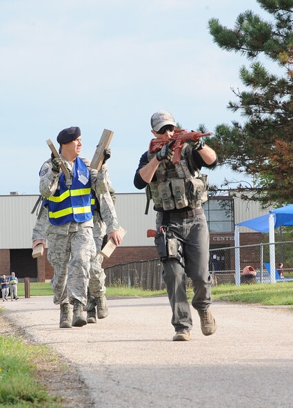 U.S. Air Force Senior Airman Grayson Brown, a 509th Security Forces Squadron (SFS) training instructor, plays the role of an active shooter during a training exercise at Whiteman Air Force Base, Mo., Aug. 5, 2016. The bi-annual exercise helps Whiteman personnel know, practice and train proper response procedures in order to reduce the risk of harm and provide direction for all base personnel. 