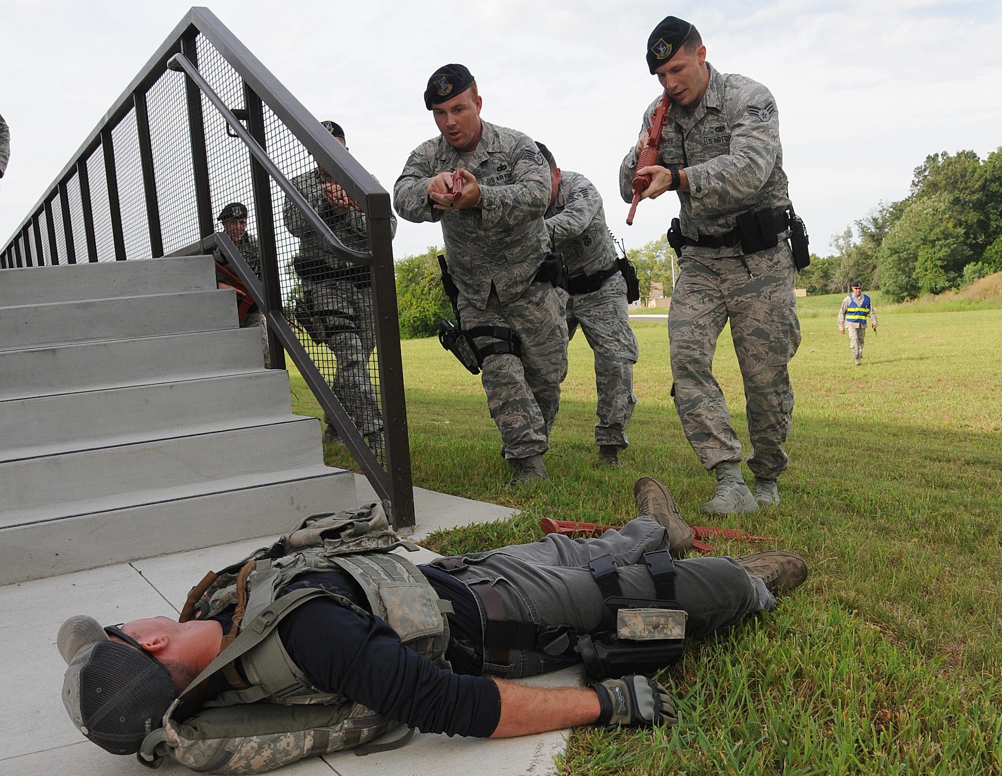 Members of the 509th Security Forces Squadron (SFS) neutralize a scenario during an active shooter exercise at Whiteman Air Force Base, Mo., Aug. 5, 2016. The bi-annual exercise helps Whiteman personnel know, practice and train proper response procedures in order to reduce the risk of harm and provide direction for all base personnel. 