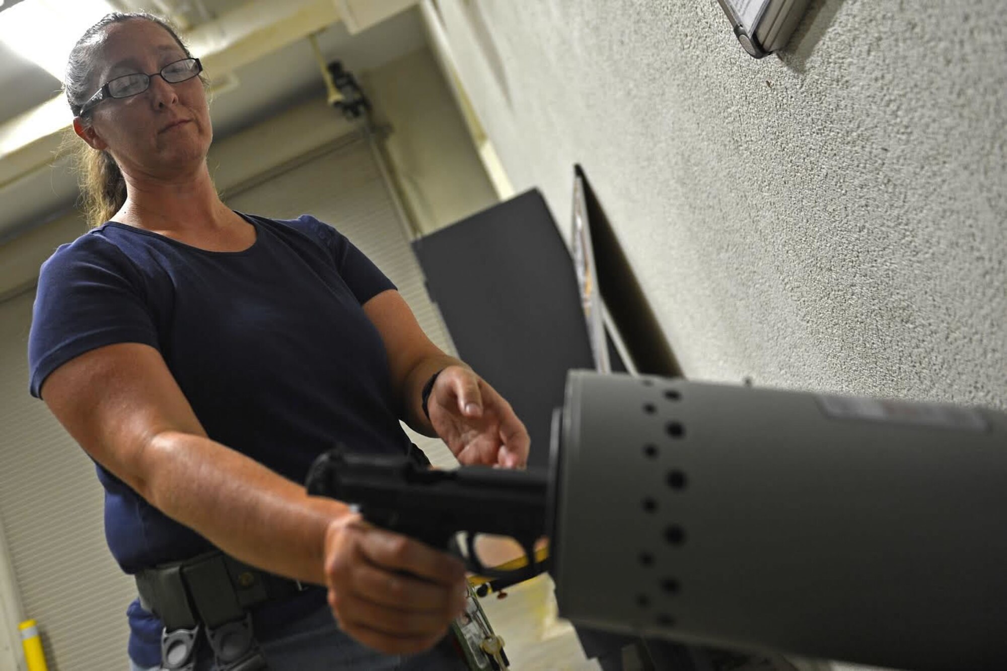 Laura Jones, 20th Logistics Readiness Squadron logistics readiness technician, clears an M9 pistol at Shaw Air Force Base, S.C., Aug. 5, 2016. This year Jones has supplied over 100 M9s and M4 carbines, and provided individual protective equipment for over 3,000 Team Shaw members. (U.S. Air Force photo by Airman 1st Class Christopher Maldonado)