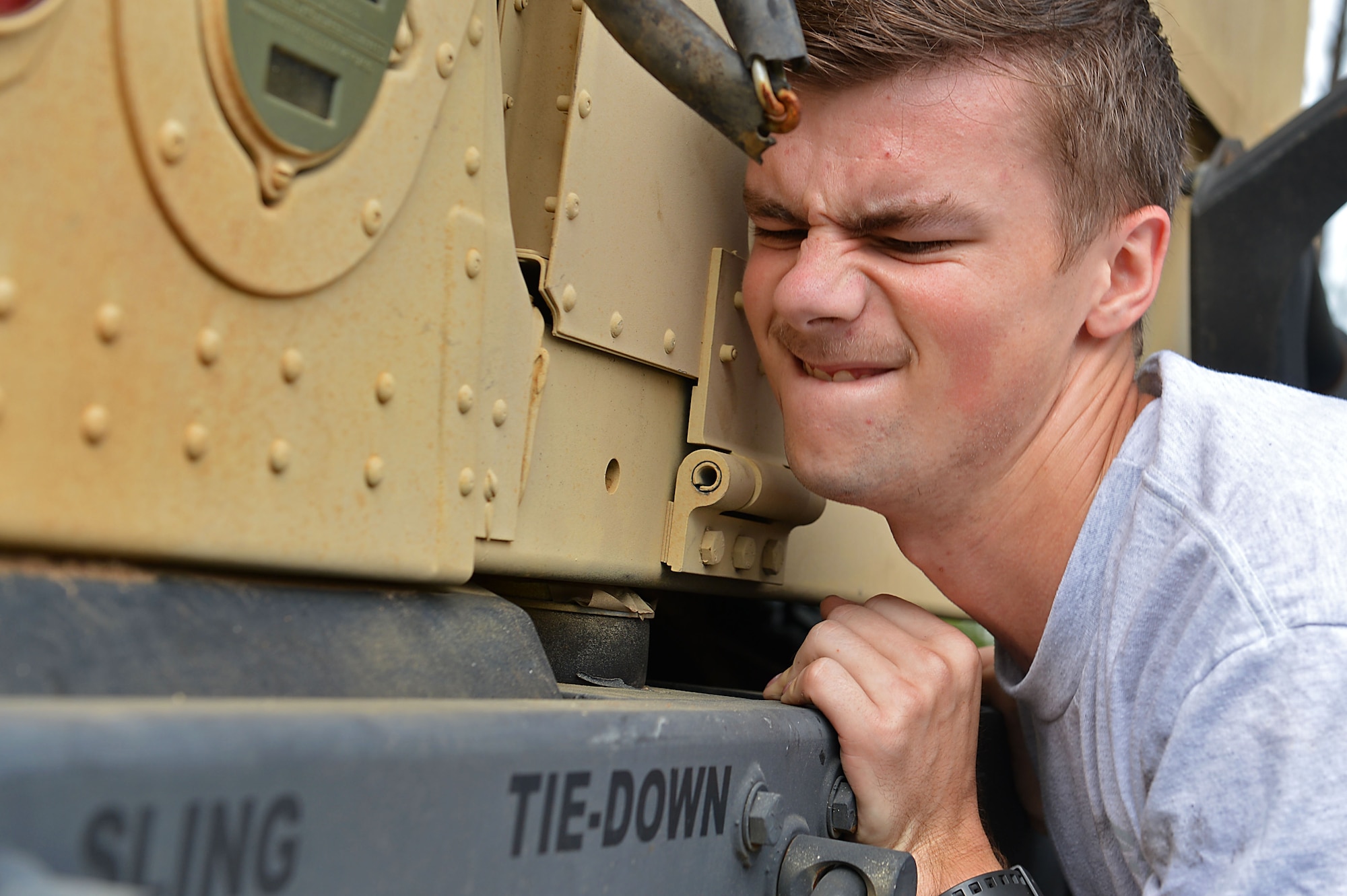 U.S. Air Force Airman 1st Class Dylen Sullivan, 20th Logistics Readiness Squadron vehicle maintenance apprentice, pushes a Humvee during a Comprehensive Airman Fitness sports day at Shaw Air Force Base, S.C., Aug. 10, 2016. Sullivan along with other Airmen, competed in a course that tested runners’ physical resiliency as well as their knowledge of the Air Force. (U.S. Air Force photo by Airman 1st Class Christopher Maldonado)