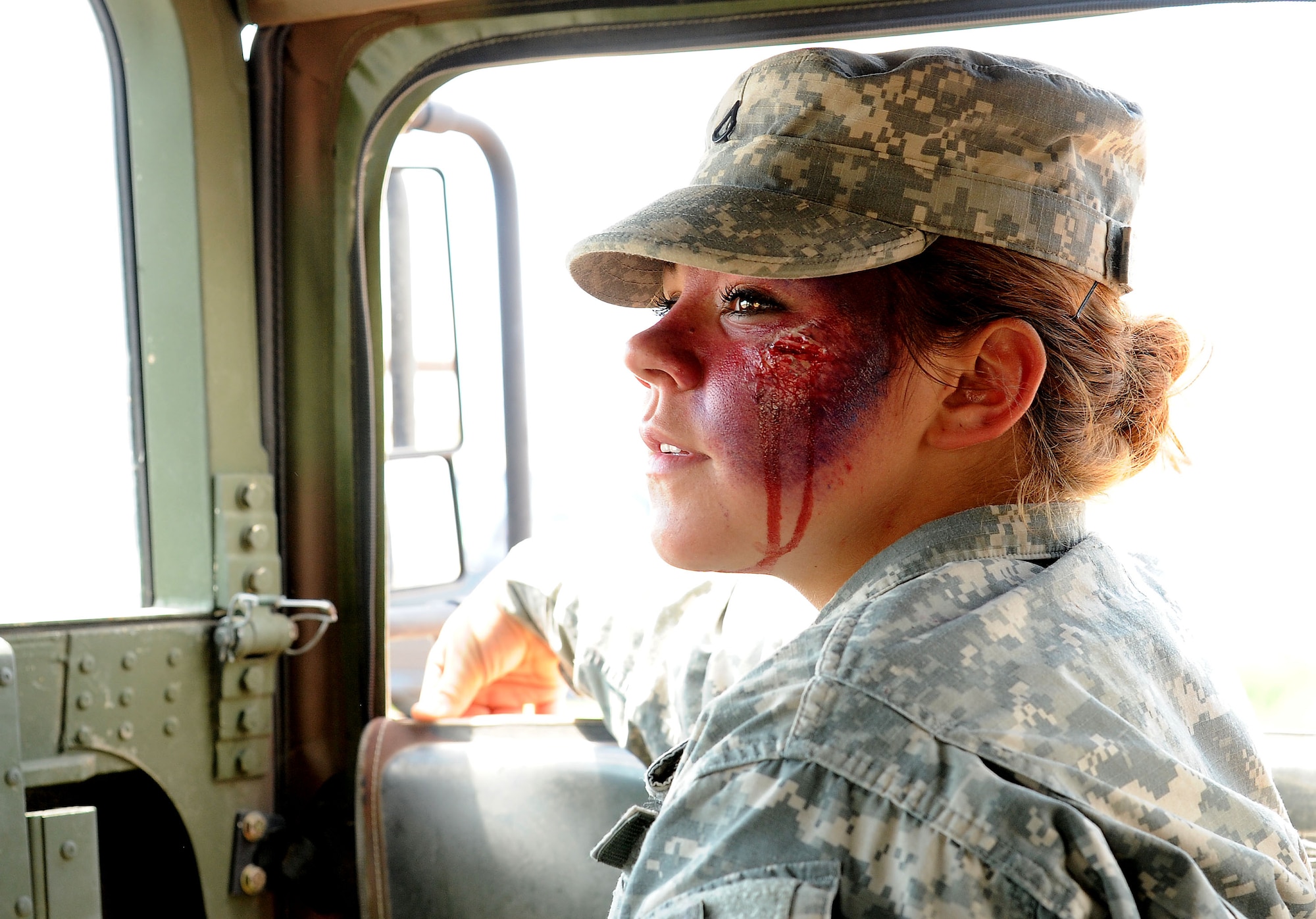 FORT CARSON, Colo. – Pfc. Makayla King, 928th Area Support Medical Company combat medic, simulates injuries during a combat medical training exercise, July 16, 2016 here. The 302nd Aeromedical Support Squadron Critical Care Air Transport Team and Army National Guardsmen from the 928th Area Support Medical Company trained jointly in tactical ground medical evacuation procedures in preparation to support the 82nd Airborne Division Joint Readiness Training Center later this year. (U.S. Air Force photo/Staff Sgt. Amber Sorsek)