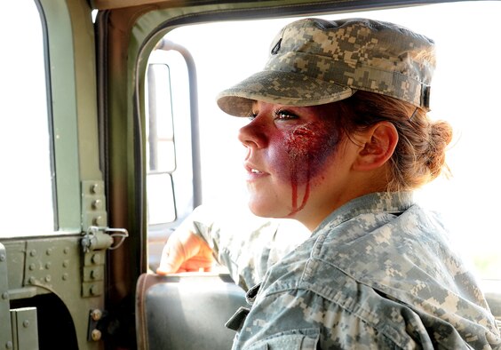FORT CARSON, Colo. – Pfc. Makayla King, 928th Area Support Medical Company combat medic, simulates injuries during a combat medical training exercise, July 16, 2016 here. The 302nd Aeromedical Support Squadron Critical Care Air Transport Team and Army National Guardsmen from the 928th Area Support Medical Company trained jointly in tactical ground medical evacuation procedures in preparation to support the 82nd Airborne Division Joint Readiness Training Center later this year. (U.S. Air Force photo/Staff Sgt. Amber Sorsek)