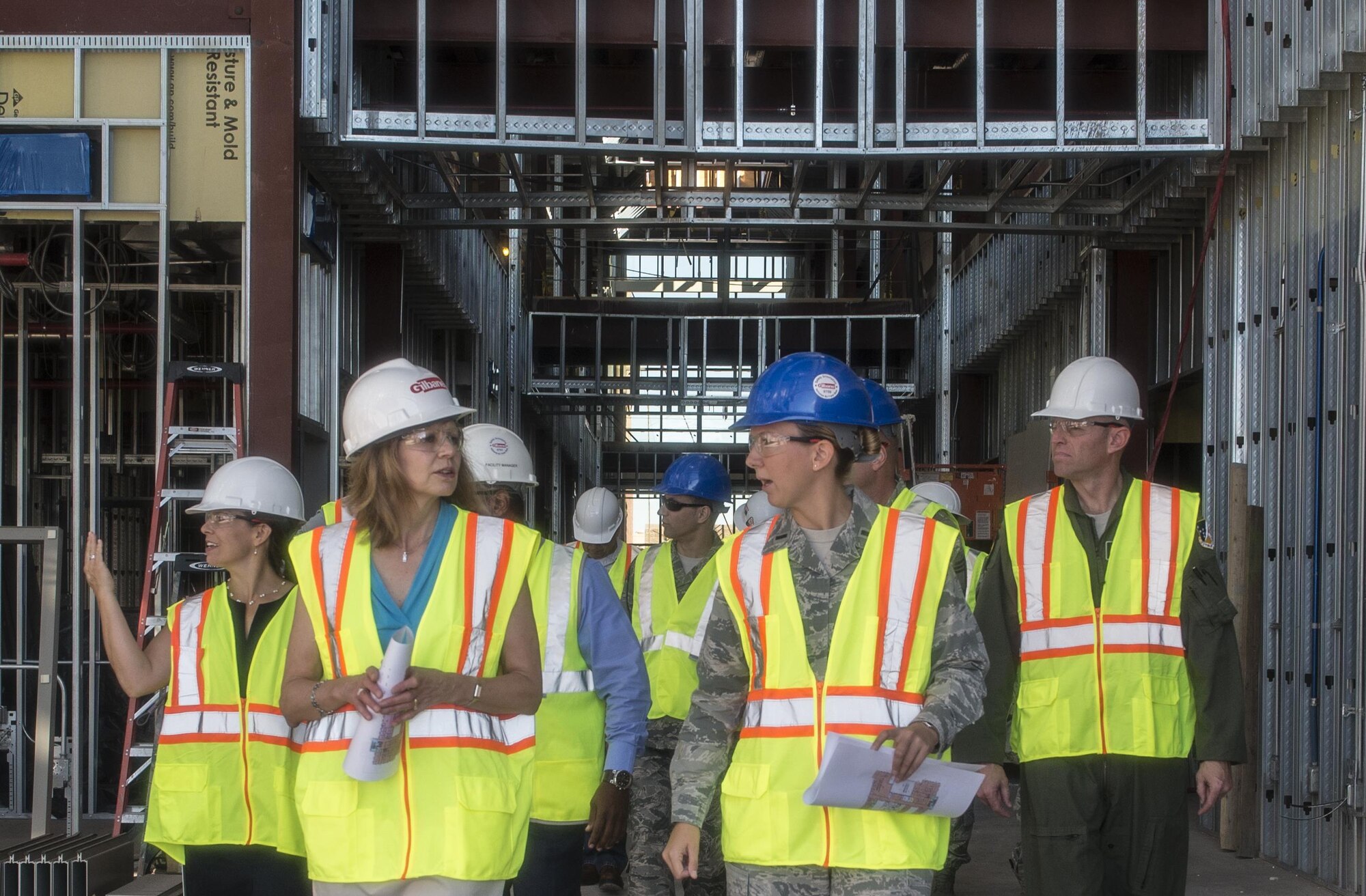 Gillian Carlisle (left), wife of Gen. Hawk Carlisle, the commander of Air Combat Command, walks through the construction site of the 49th Medical Group’s new medical clinic Aug. 4, 2016 at Holloman Air Force Base, N.M. Mrs. Carlisle’s visit included a meeting with Holloman’s key spouses, a tour of Holloman Elementary and Middle schools, and a discussion with Holloman’s senior staff and the Sexual Assault Response Coordinator. (U.S. Air Force photo by Staff Sgt. E’Lysia A. Wray)