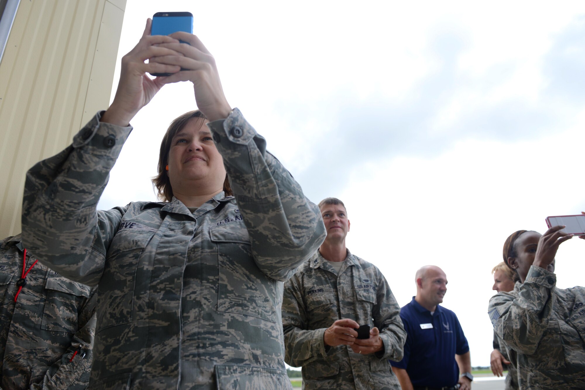 Friends and family take photos of Air Force Lt. Gen. Russell Handy after his final flight as Alaskan Command, Alaskan North American Aerospace Defense Region and 11th Air Force commander, at Joint Base Elmendorf-Richardson, Alaska, Aug. 10, 2016. As commander of the Alaskan Region of the North American Aerospace Defense Command, Handy directs operations to ensure effective surveillance, monitoring and defense of the region’s airspace. (U.S. Air Force photo by Airman 1st Class Javier Alvarez)