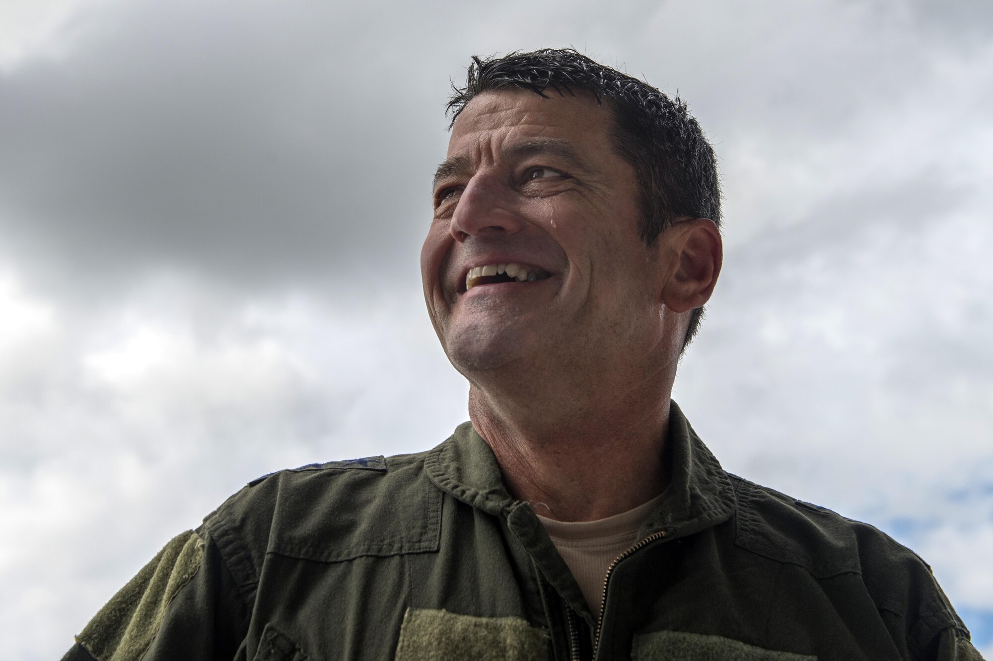 Air Force Lt. Gen. Russell Handy smiles after his final flight as Alaskan Command, Alaskan North American Aerospace Defense Region and 11th Air Force commander at Joint Base Elmendorf-Richardson, Alaska, Aug. 10, 2016. Handy was hosed-down with water and champagne after his final flight. Handy is the senior military officer in Alaska, responsible for the integration of all military activities in the Alaska joint operations area, synchronizing the activities of more than 21,000 active-duty and reserve forces from all services. (U.S. Air Force photo by Airman 1st Class Javier Alvarez)