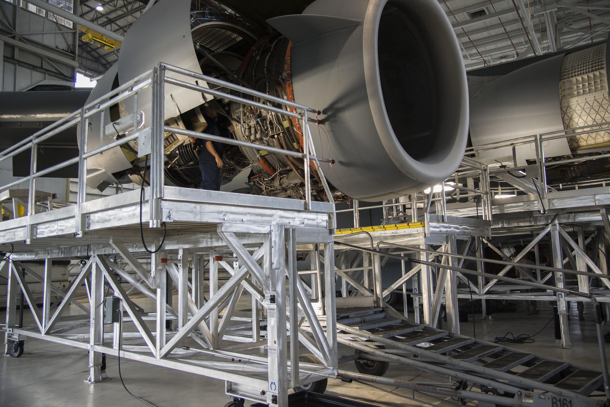 A new C-17 Engine Maintenance Platform surrounds the engines on a C-17A Globemaster III on Aug. 1, 2016, at Dover Air Force Base, Del. The 736th Aircraft Maintenance Squadron began using the new platforms in July, 2016, to foster a safer and more streamline inspection process. (U.S. Air Force photo by Senior Airman Aaron J. Jenne)