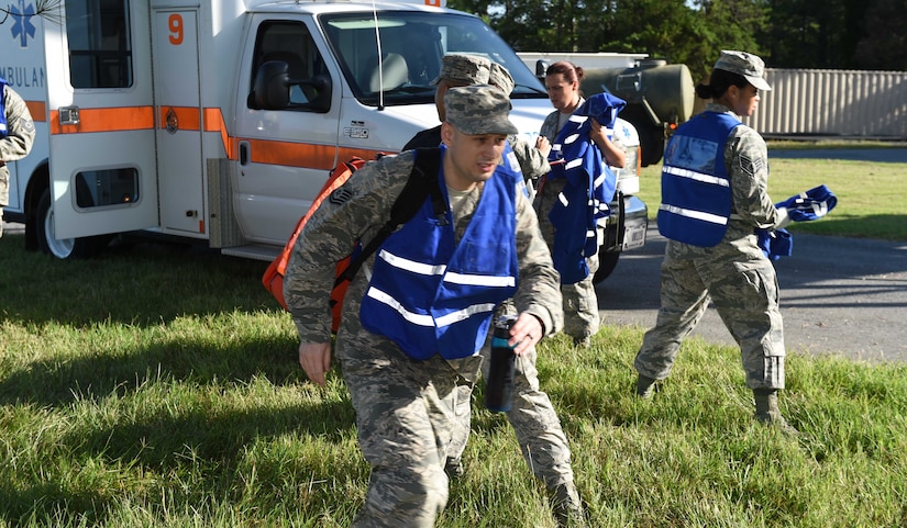 Medical staff from the 79th Medical Wing’s units rush to the scene of a simulated F-16 aircraft crash for the Major Accident Response Exercise at Joint Base Andrews, Md., Aug. 11, 2016. The MARE is an annual training requirement for a base to test its readiness and response capabilities. (U.S. Air Force photo by Senior Airman Joshua R. M. Dewberry)