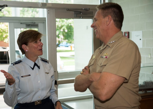 Gen. Lori Robinson, commander, North American Aerospace Defense Command and U.S. Northern Command is greeted by Adm. Phil Davidson, commander, U.S. Fleet Forces (USFF) Command  on the USFF quarterdeck at the start of her visit to Norfolk, Virginia, Aug. 11, 2016. The General’s visit included a maritime domain awareness brief at the USFF Maritime Operations Center, a tour of Arleigh Burke-class destroyer USS Gonzalez (DDG 66), and a hall of fame induction ceremony at the Joint Forces Staff College. (U.S. Navy photo by Mass Communication Specialist 2nd Class Benjamin Dobbs/Released) 
