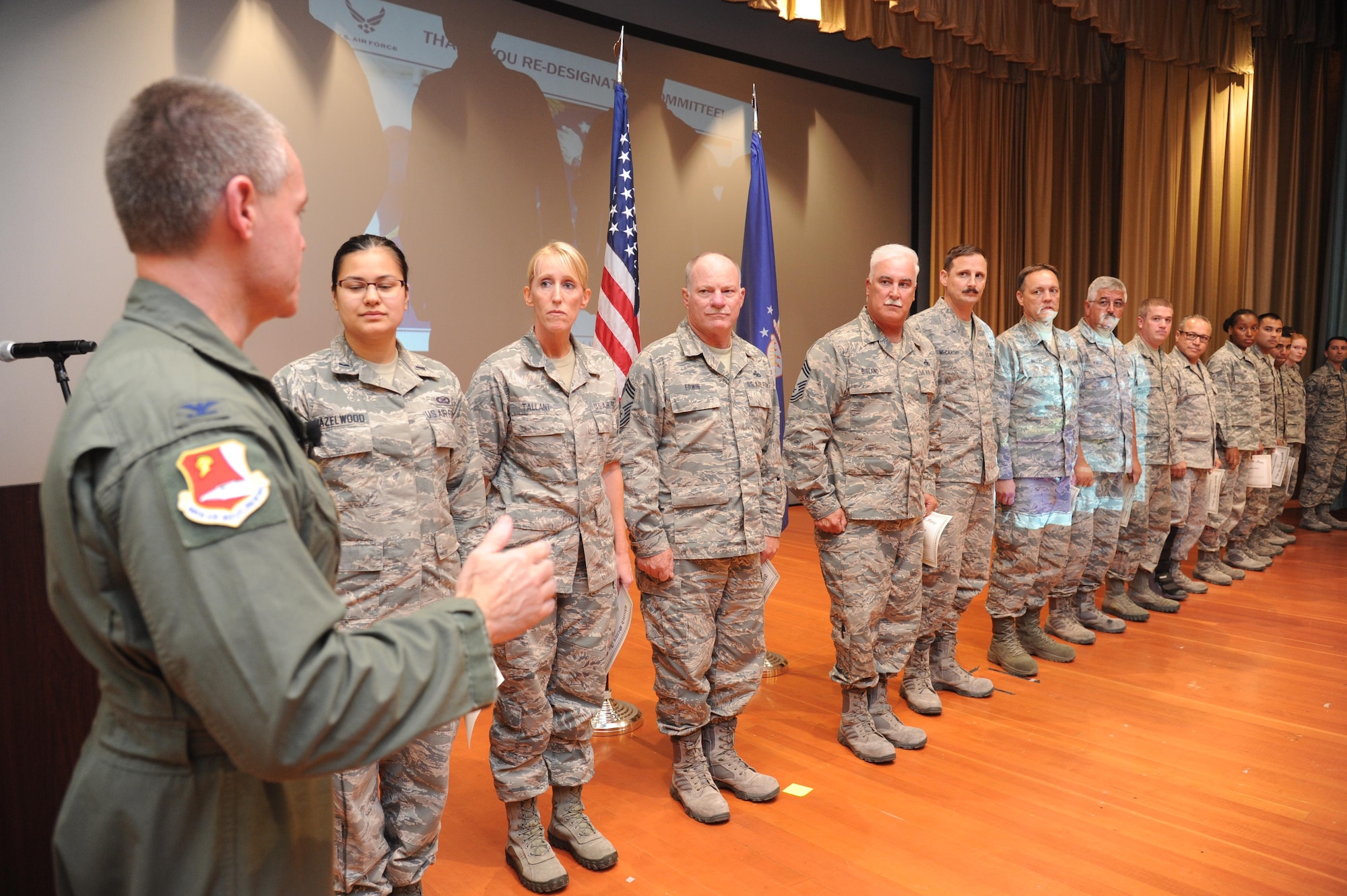 Col. Craig Peters, 940th Air Refueling Wing commander, recognized members of the redesignation ceremony committee during a Commander's Call at Beale Air Force Base, California on August 7, 2016. Peters recognized the committee for their outstanding efforts in organizing and executing a redesignation ceremony and three assumptions of command on June 4, 2016. (U.S. Air Force photo by Tech. Sgt. Heather Skinkle)
