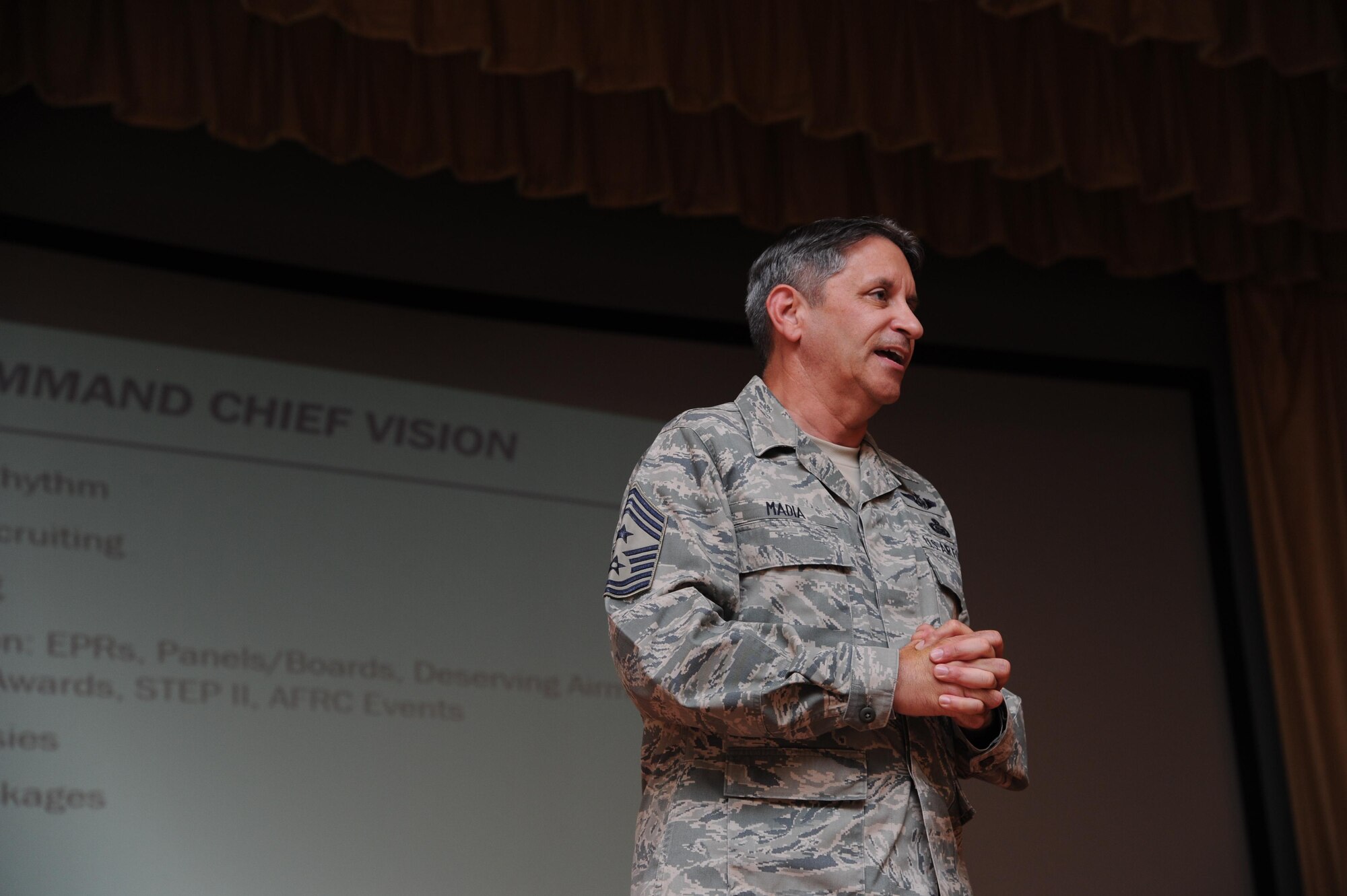 Chief Master Sgt. Carmen Madia, 940th Air Refueling Wing command chief delivers his first impressions and battle rhythm to Beale Citizen Airmen during a Commander's Call at Beale Air Force Base, California on August 7, 2016. Madia's goal during his tenure as the 940 ARW command chief is to ensure he goes around to the various units within the wing to listen to what is and isn't working at their units.(U.S. Air Force photo by Tech. Sgt. Heather Skinkle)