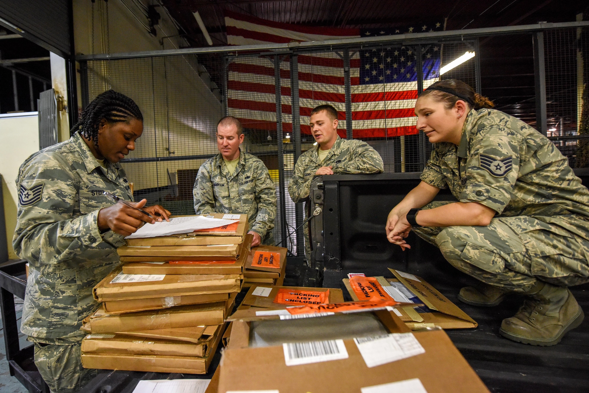Tech. Sgt. Jewel Stott (left), 4th LRS NCO in-charge of Centralized Repair Facility, reviews a list of maintenance parts delivered by Airmen from the 4th Component Maintenance Squadron, Aug. 3, 2016, at Seymour Johnson Air Force Base, North Carolina. Airmen from the 4th CMS back shop pick-up, fix, and redeliver maintenance parts in need of repair that are then stored at the CRF and entered into a database for other bases to access, search and order parts. (U.S. Air Force photo by Airman Shawna L. Keyes)