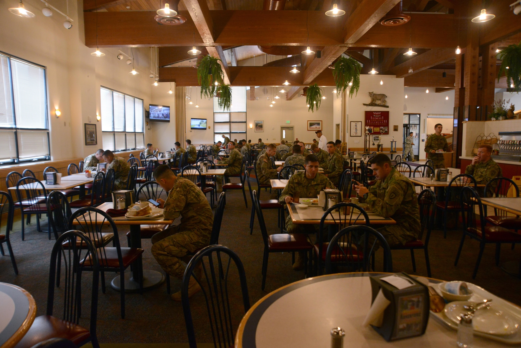 Soldiers eat at the Wilderness Inn dining facility at Joint Base Elmendorf-Richardson, Alaska, July 6, 2016. The Philip A. Connelly award provides recognition for excellence in the preparation and serving of food in Army dining facilities and during field kitchen operations. (U.S. Air Force photo by Airman 1st Class Christopher R. Morales)