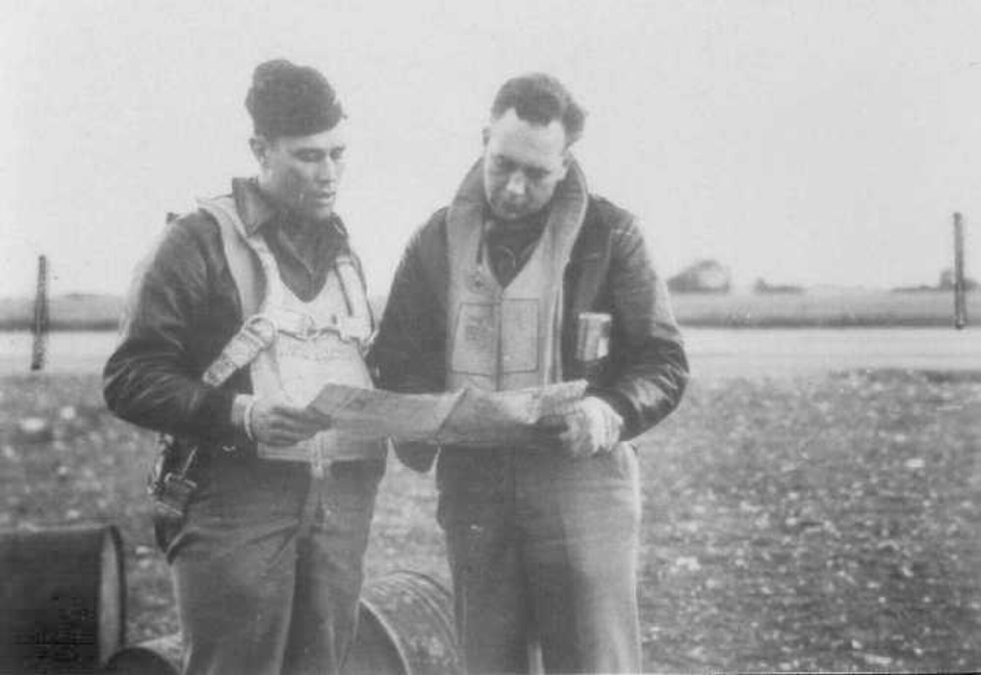 Col. Clifford Heflin, while Commander of the 592nd Bomb Group, also known as the Carpetbaggers, confers with the Group's Intelligence Officer, in 1944. (Courtesy photo)
