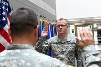 Staff Sgt. Walter Rodgers, Human Resources Sergeant, states the oath of enlistment during a reenlistment ceremony at the 85th Support Command's Battle Assembly weekend, Aug. 6, 2016.
(Photo by Spc. David Lietz)
