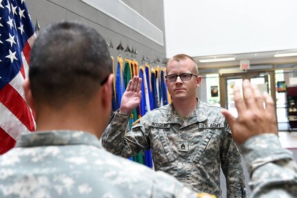 Staff Sgt. Walter Rodgers, Human Resources Sergeant, states the oath of enlistment during a reenlistment ceremony at the 85th Support Command's Battle Assembly weekend, Aug. 6, 2016.
(Photo by Spc. David Lietz)