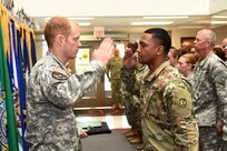 Captain Russell Litko, Headquarters & Headquarters Company commander, 85th Support Command, left, returns a salute to Sgt. Roje Rogers, Supply Sergeant, 85th Support Command, during an award ceremony presentation during the command's battle assembly, on Aug. 7, 2016. Rogers received the Army Commendation Medal during the ceremony.
(Photo by Spc. David Lietz)