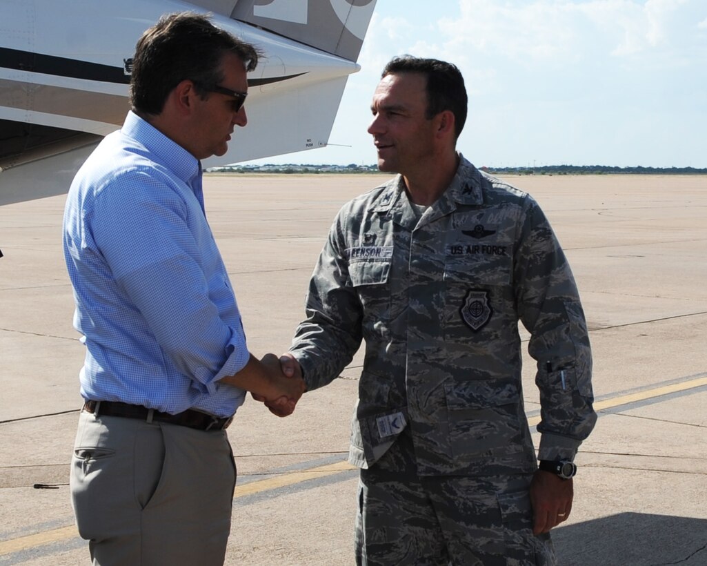 U.S. Air Force Col. David Benson, 7th Bomb Wing commander, greets U.S. Sen. Ted Cruz Aug. 11, 2016, at Dyess Air Force Base, Texas. The purpose of the visit was to introduce Cruz to the base and its mission sets and get a glimpse at a day in the life of the Airmen who support Team Dyess. (U.S. Air Force photo by Senior Airman Kedesha Pennant/Released)