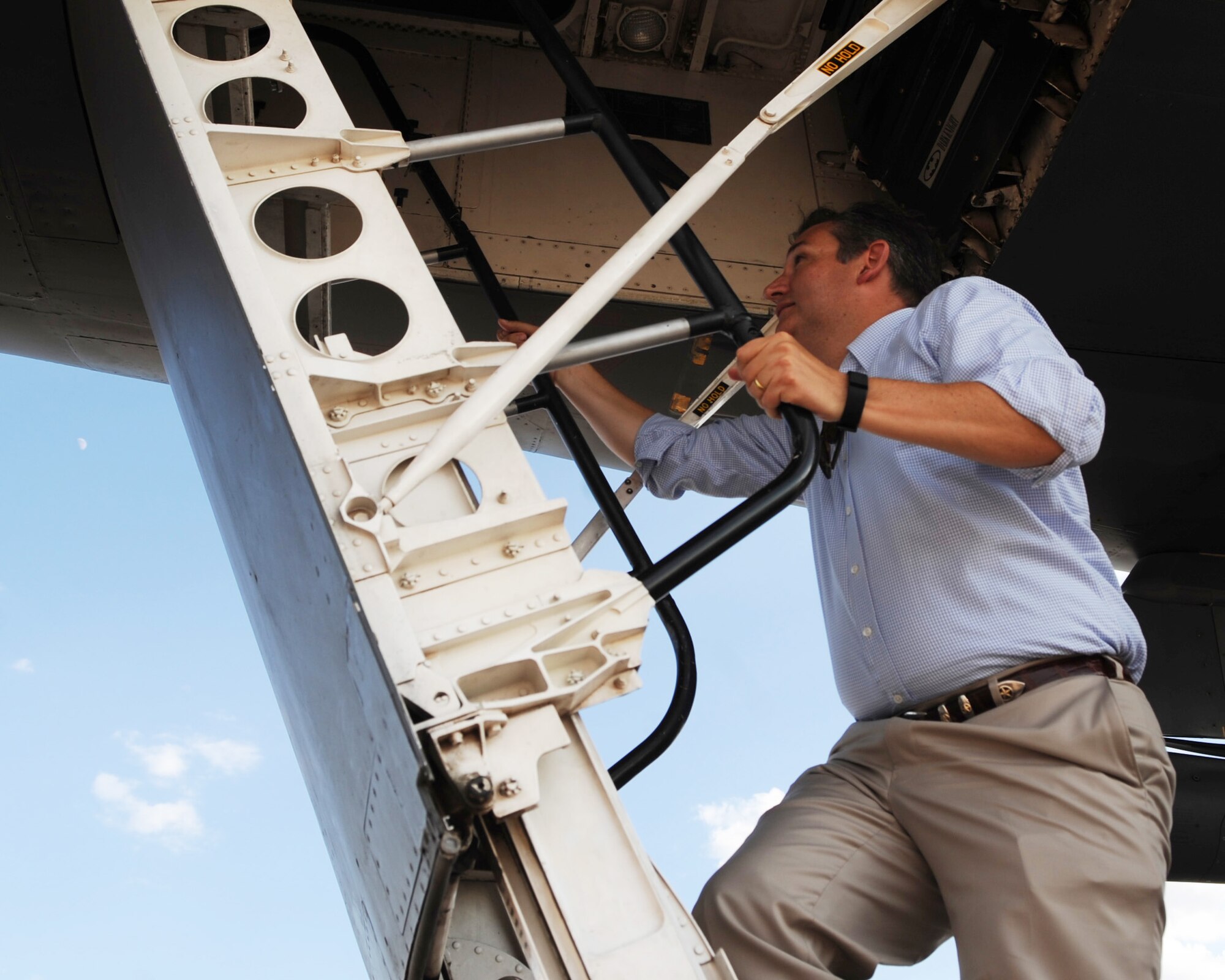 U.S. Sen. Ted Cruz climbs the ladder of a B-1B Lancer Aug. 11, 2016, at Dyess Air Force Base, Texas. The senator was able to get an up-close look at the bomber and learn about its mission. (U.S. Air Force photo by Senior Airman Kedesha Pennant/Released)