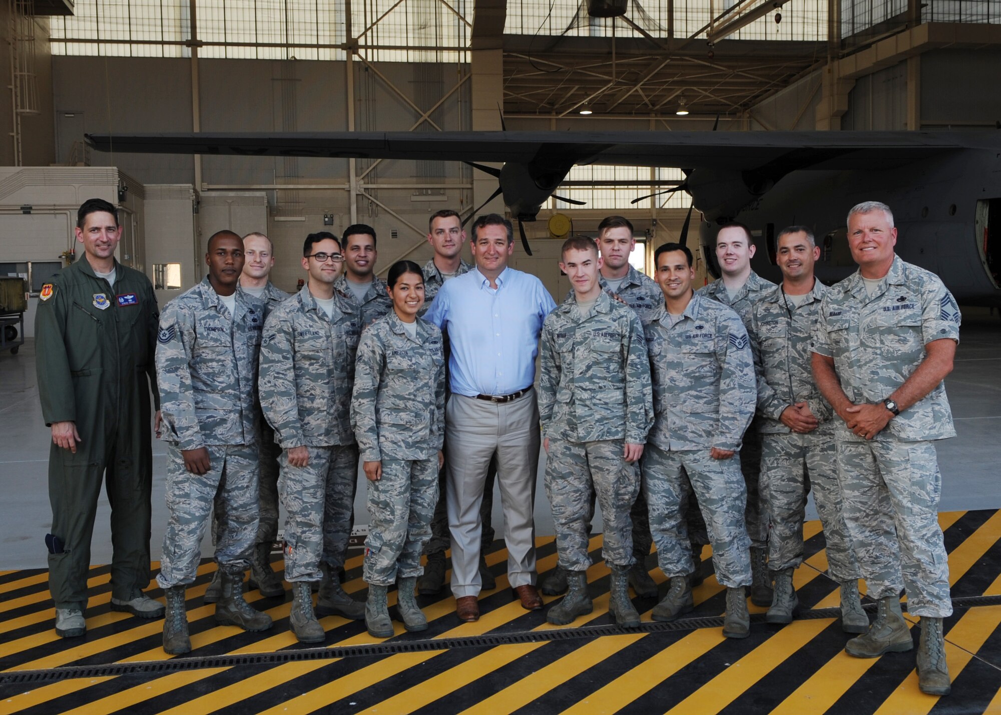 U.S. Sen. Ted Cruz poses for a photo with Airmen assigned to the 317th Airlift Group Aug. 11, 2016, at Dyess Air Force Base, Texas. He was briefed by senior leaders on the capabilities of the 7th Bomb Wing and 317th Airlift Group, toured the base and received an up-close look at the C-130J and B-1B Lancer.