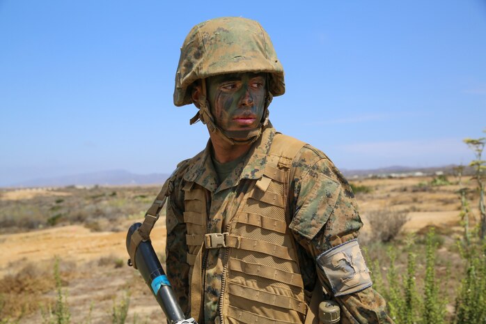 Lance Cpl. Sean C. Kennedy, Mike Company, 3rd Recruit Training Battalion, stands with his rifle during the crucible at Marine Corps Base Camp Pendleton, Calif. Aug. 5. Following recruit training, Kennedy will report to the School of Infantry at Marine Corps Base Camp Pendleton, Calif., and then to his military occupational specialty school to become a linguist specialist. Annually, more than 17,000 males recruited from the Western Recruiting Region are trained at MCRD San Diego.