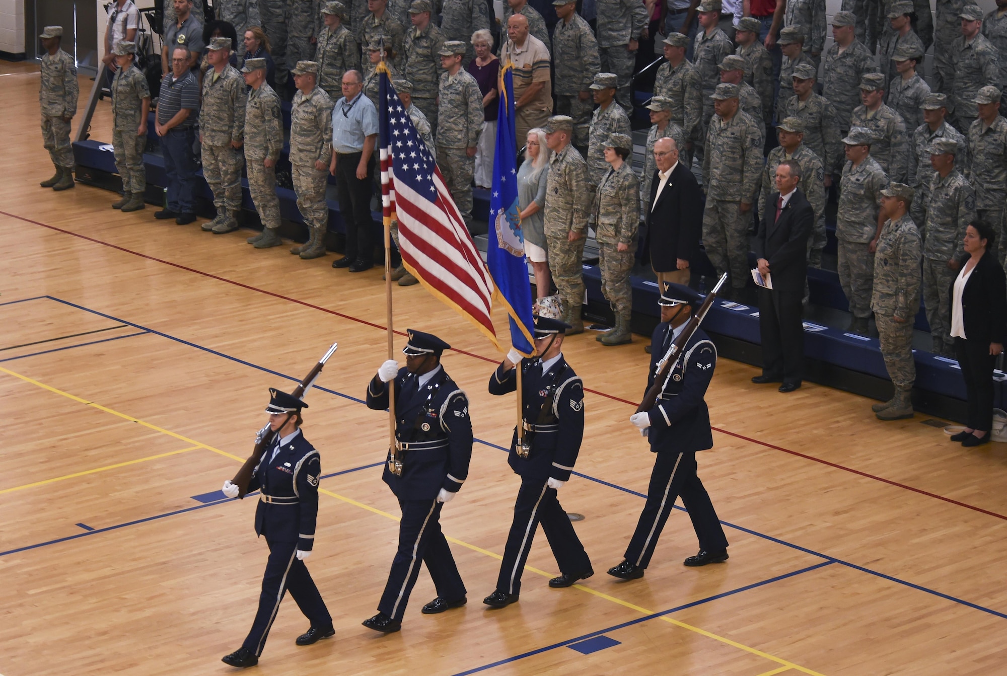 Mile High Honor Guard presents the colors during the 460th Space Wing change of command ceremony August 12, 2016, at the Buckley Fitness Center on Buckley Air Force Base, Colo. The change of command ceremony represents the formal passing of responsibility, authority and accountability of command from one officer to another. (U.S. Air Force photo by Staff Sgt. Katrina M. Brisbin/Released)