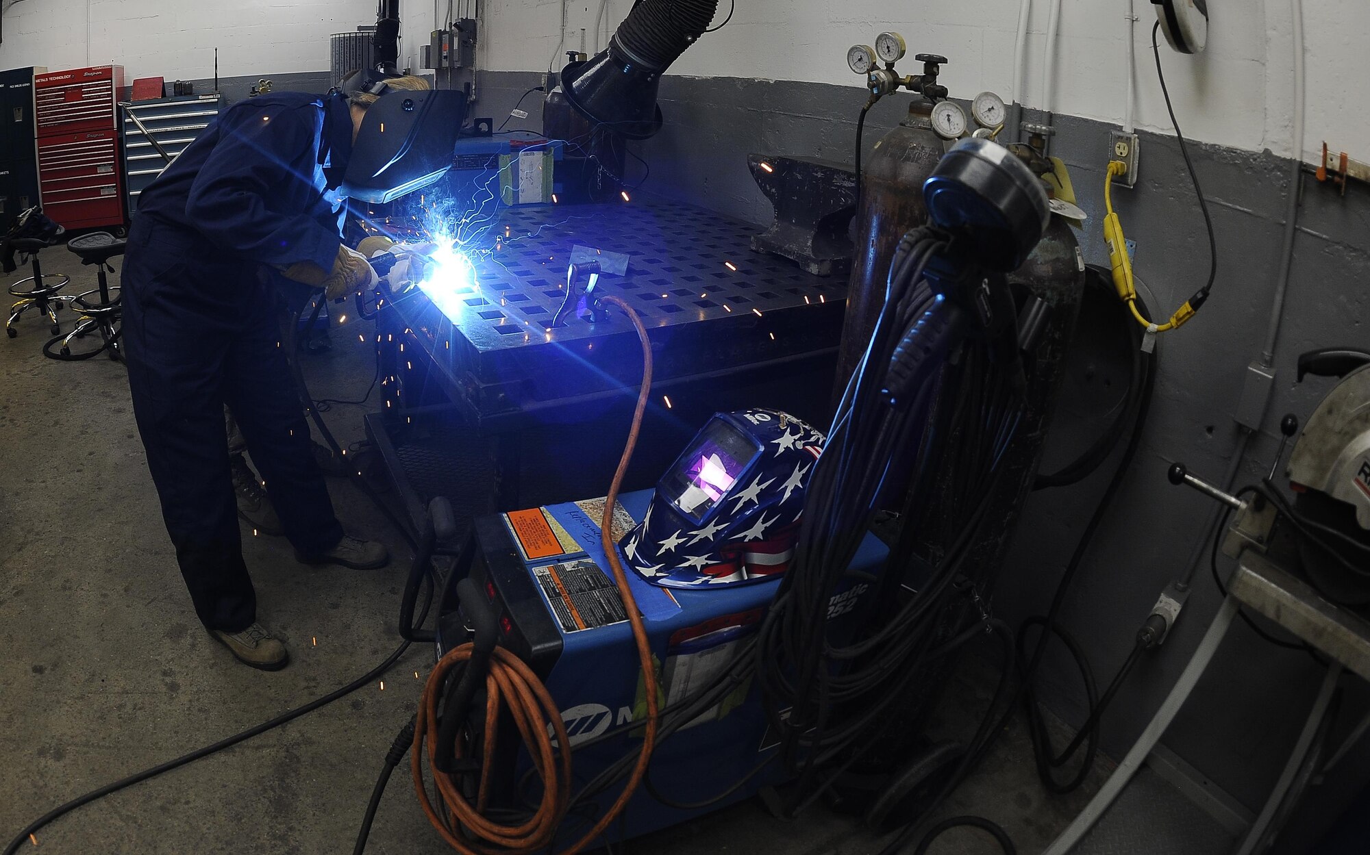 Col. April Vogel, left, commander of the 6th Air Mobility Wing, welds a mild steel plate during Airmen’s time, Aug. 11, 2016, at MacDill Air Force Base, Fla. Vogel practiced gas metal arc welding on a mild steel plate. (U.S. Air Force photo by Airman 1st Class Mariette Adams)