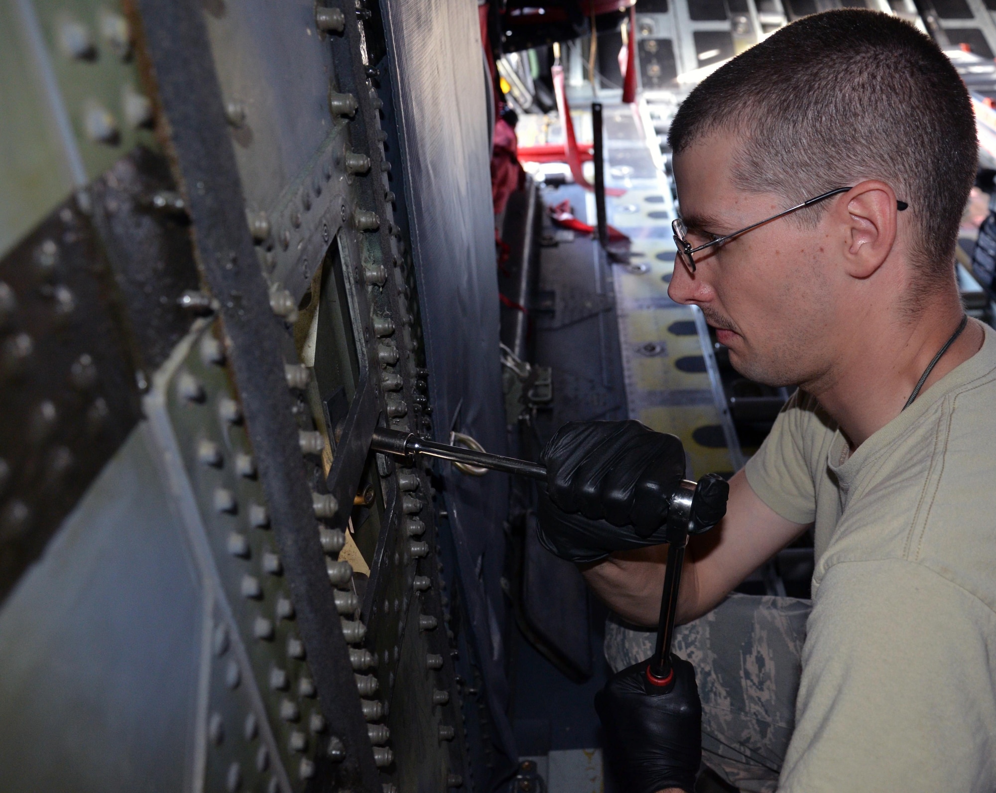 Two maintenance squadrons from the 920th Rescue Wing, Patrick Air Force Base Florida, teamed up to work on a HC-130P/N refueling aircraft, to replace its struts August 2. (U.S. Air Force Photo approved/released by Senior Airman Brandon P. Kalloo Sanes)