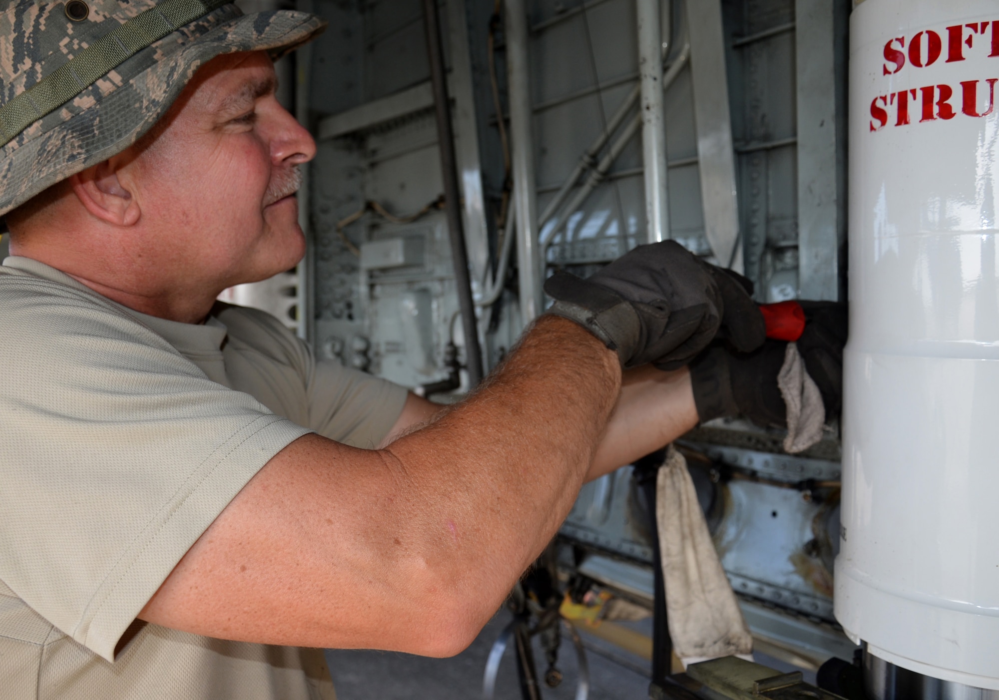 Two maintenance squadrons from the 920th Rescue Wing, Patrick Air Force Base Florida, teamed up to work on a HC-130P/N refueling aircraft, to replace its struts August 2. (U.S. Air Force Photo approved/released by Senior Airman Brandon P. Kalloo Sanes)