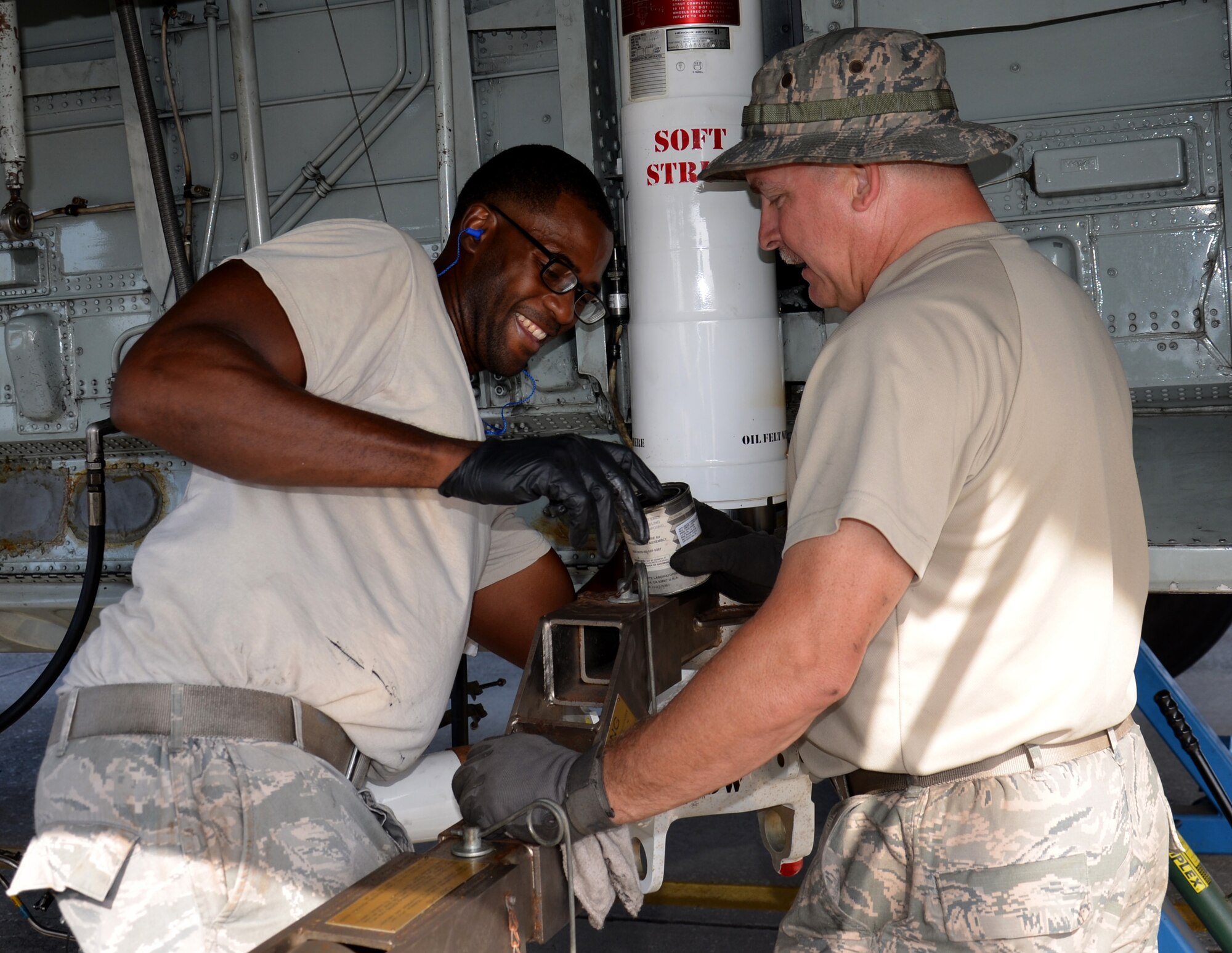 Two maintenance squadrons from the 920th Rescue Wing, Patrick Air Force Base Florida, teamed up to work on a HC-130P/N refueling aircraft, to replace its struts August 2. (U.S. Air Force Photo approved/released by Senior Airman Brandon P. Kalloo Sanes)