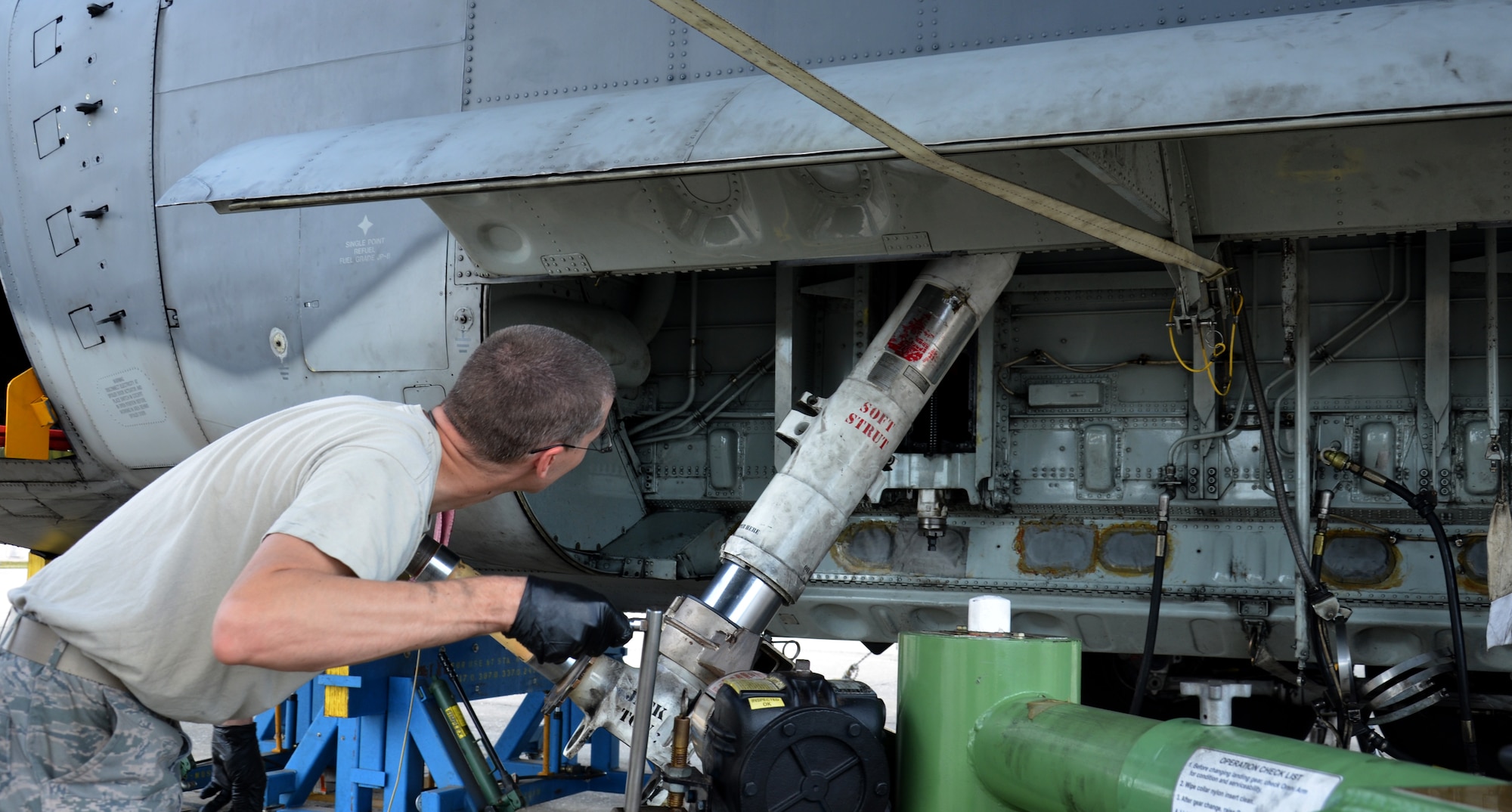Two maintenance squadrons from the 920th Rescue Wing, Patrick Air Force Base Florida, teamed up to work on a HC-130P/N refueling aircraft, to replace its struts August 2. (U.S. Air Force Photo approved/released by Senior Airman Brandon P. Kalloo Sanes)