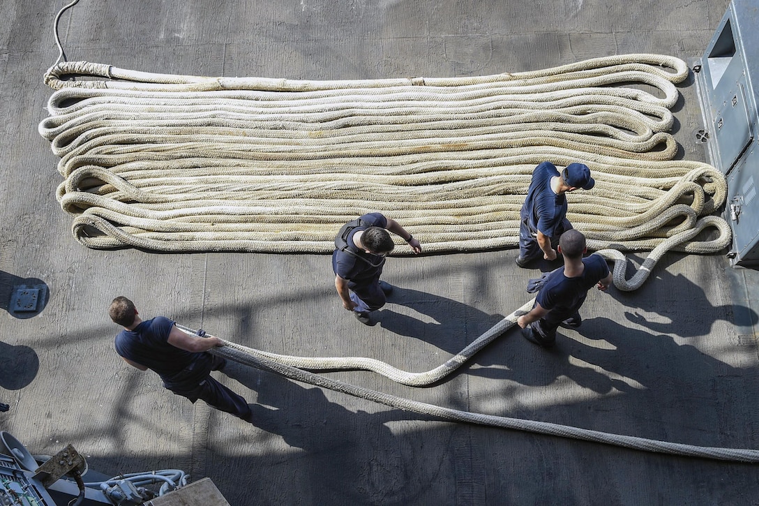 Sailors handle mooring lines on the aircraft carrier USS Dwight D. Eisenhower in the Arabian Gulf, Aug. 11, 2016. The ship and its carrier strike group are supporting Operation Inherent Resolve, maritime security operations and theater security cooperation efforts in the U.S. 5th Fleet area of operations. Navy photo by Petty Officer 3rd Class Theodore Quintana
