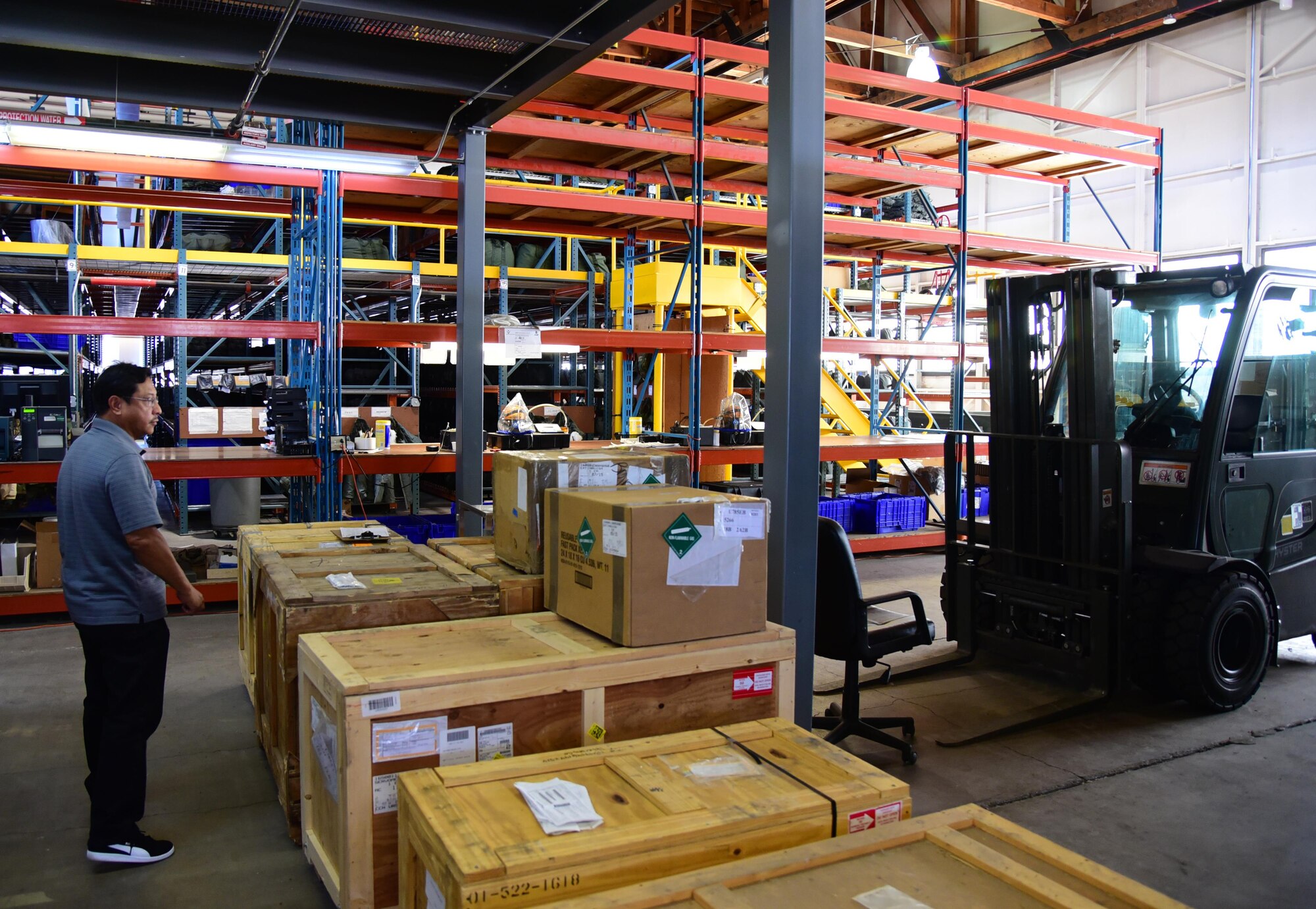 Butch Castillo, 21st Logistic Readiness Squadron Aircraft Parts Store asset manager section chief, walks through the parts warehouse at Peterson Air Force Base, Colo., Aug. 1, 2016. The warehouse contains over 44.5 million C-130 Hercules aircraft parts to ship world-wide. (U.S. Air Force photo by Staff Sgt. Amber Grimm)