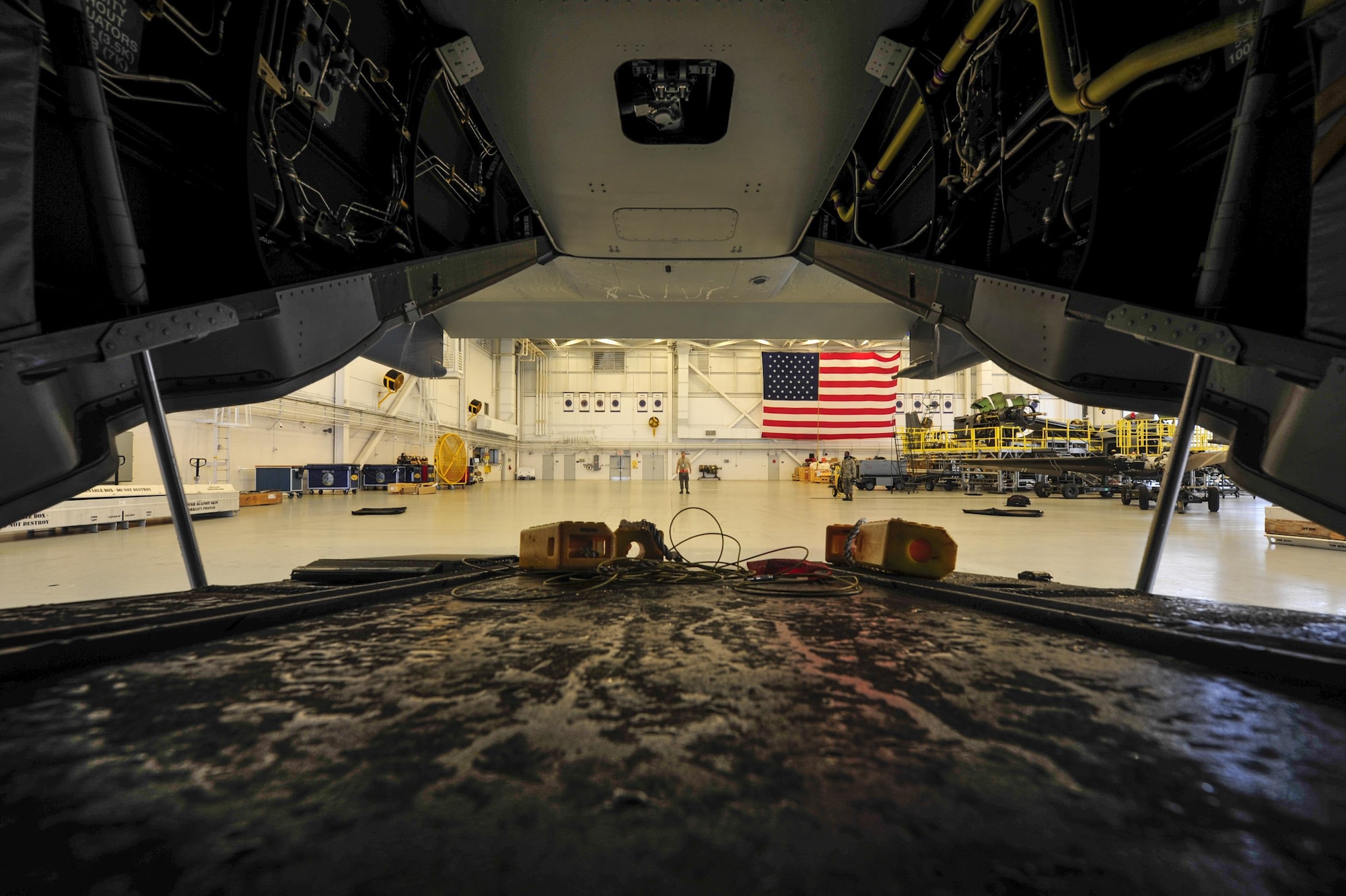 Crew chiefs with the 801st Special Operations Aircraft Maintenance Squadron tow a CV-22B Osprey tiltrotor aircraft into the Freedom Hangar at Hurlburt Field, Fla., Aug. 11, 2016. The 801st SOAMXS crew chiefs continued normal operations despite the inclement weather. (U.S. Air Force photo by Airman 1st Class Joseph Pick)