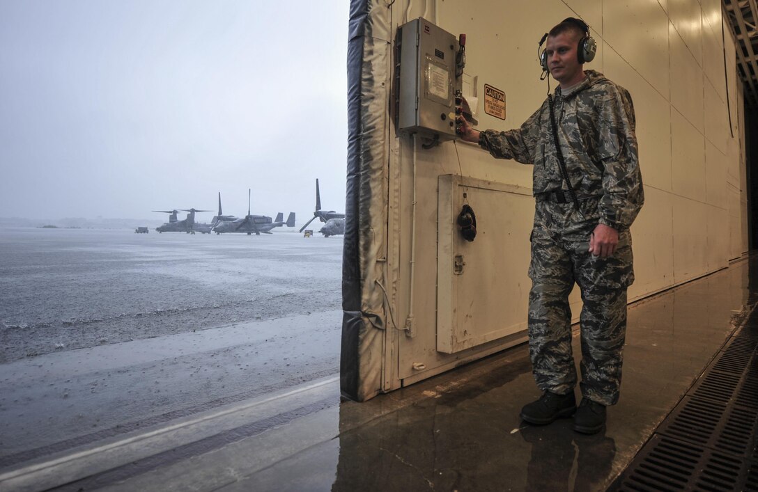 Staff Sgt. Jonathan Knutson, a crew chief with the 801st Special Operations Aircraft Maintenance Squadron, closes the Freedom Hangar at Hurlburt Field, Fla., Aug. 11, 2016. Crew chiefs with the 801st SOAMXS ensure aircraft are ready to fly at a moment’s notice to provide combat ready forces anytime, anyplace (U.S. Air Force photo by Airman 1st Class Joseph Pick)