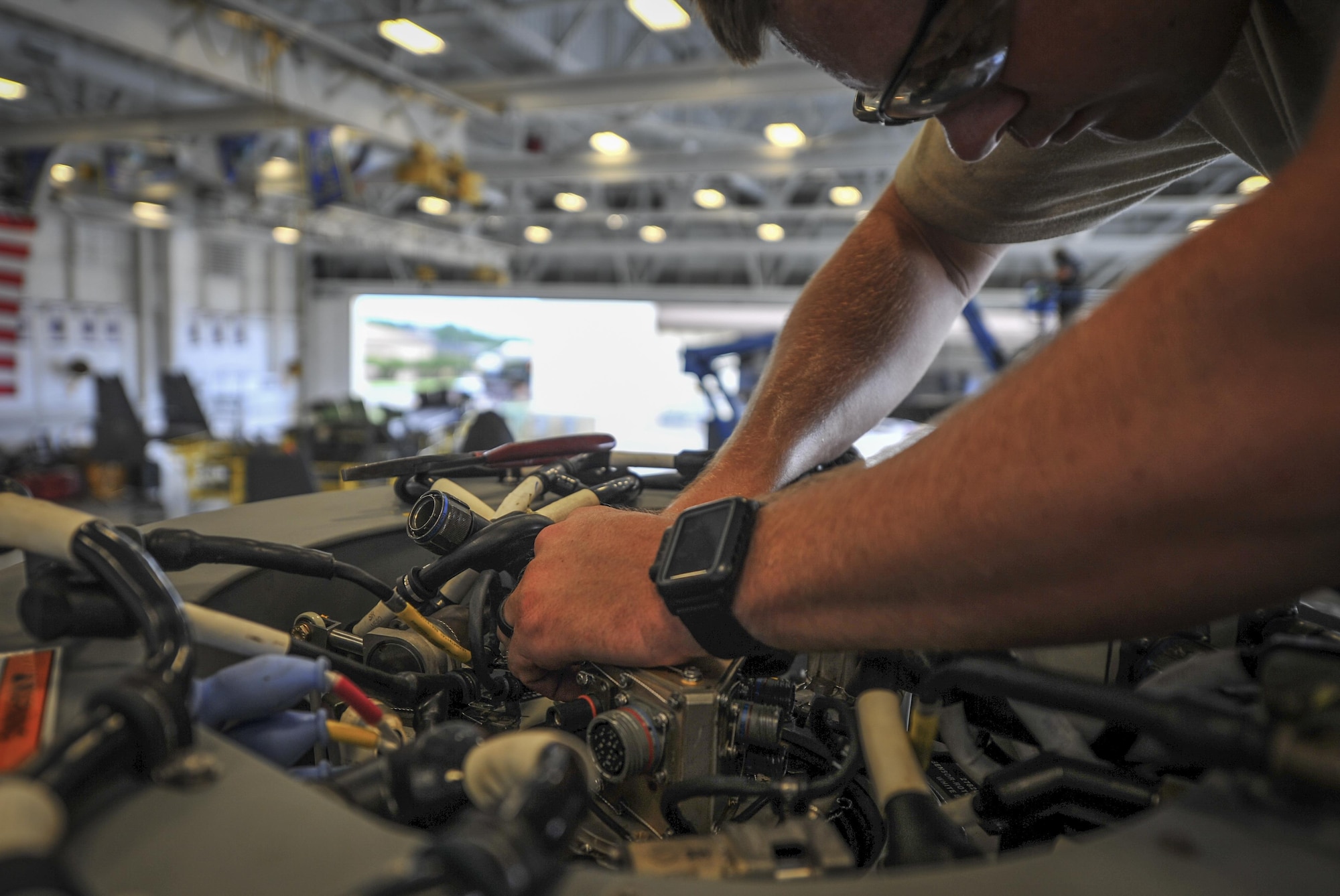 Staff Sgt. Robert Hillyard, a crew chief with the 801st Special Operations Aircraft Maintenance Squadron, performs maintenance on the tiltrotor of a CV-22B Osprey at Hurlburt Field, Fla., Aug. 11, 2016. Crew chiefs with the 801st SOAMXS ensure aircraft are ready to fly at a moment’s notice to provide combat ready forces anytime, anyplace. (U.S. Air Force photo by Airman 1st Class Joseph Pick)