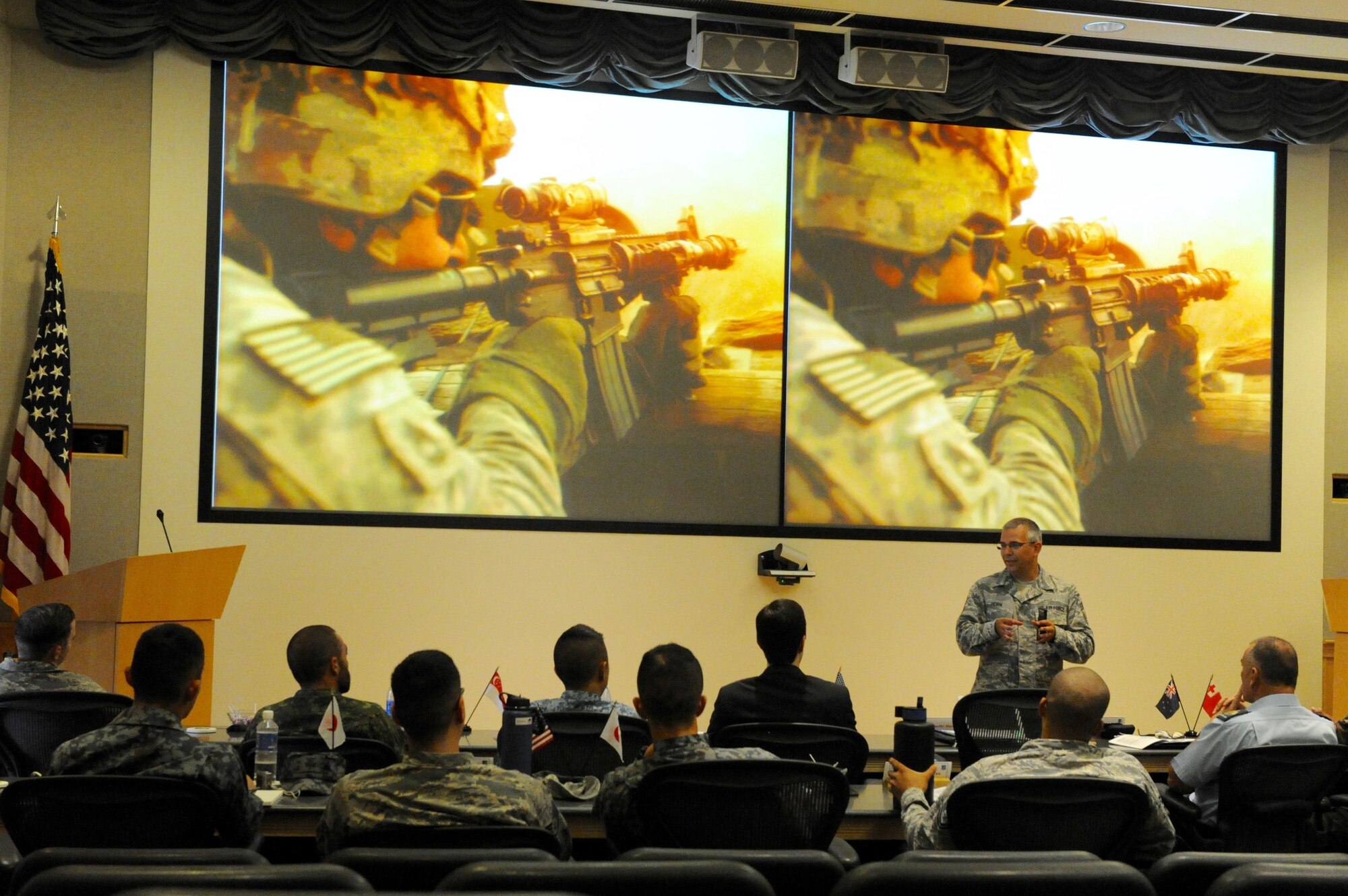 U.S. Air Force Chief Master Sgt. Timothy Horn, the Air University command chief at Maxwell Air Force Base, Ala., briefs joint warfighter concepts during the first U.S. led, Pacific Rim Junior Enlisted Leadership Forum (JELF) at Joint Base Pearl Harbor-Hickam, Hawaii, Aug 10. 2016. A U.S. Soldier and Airmen from Australia, Cambodia, Canada, Indonesia, Japan, Maldives, Mongolia, New Zealand, Philippines, Singapore, and the United States came together during the JELF to share experiences and to gain valuable insight on leadership development in order to grow as tomorrow's senior enlisted leaders.  (U.S. Air Force photo by Staff Sgt. Kamaile Chan)