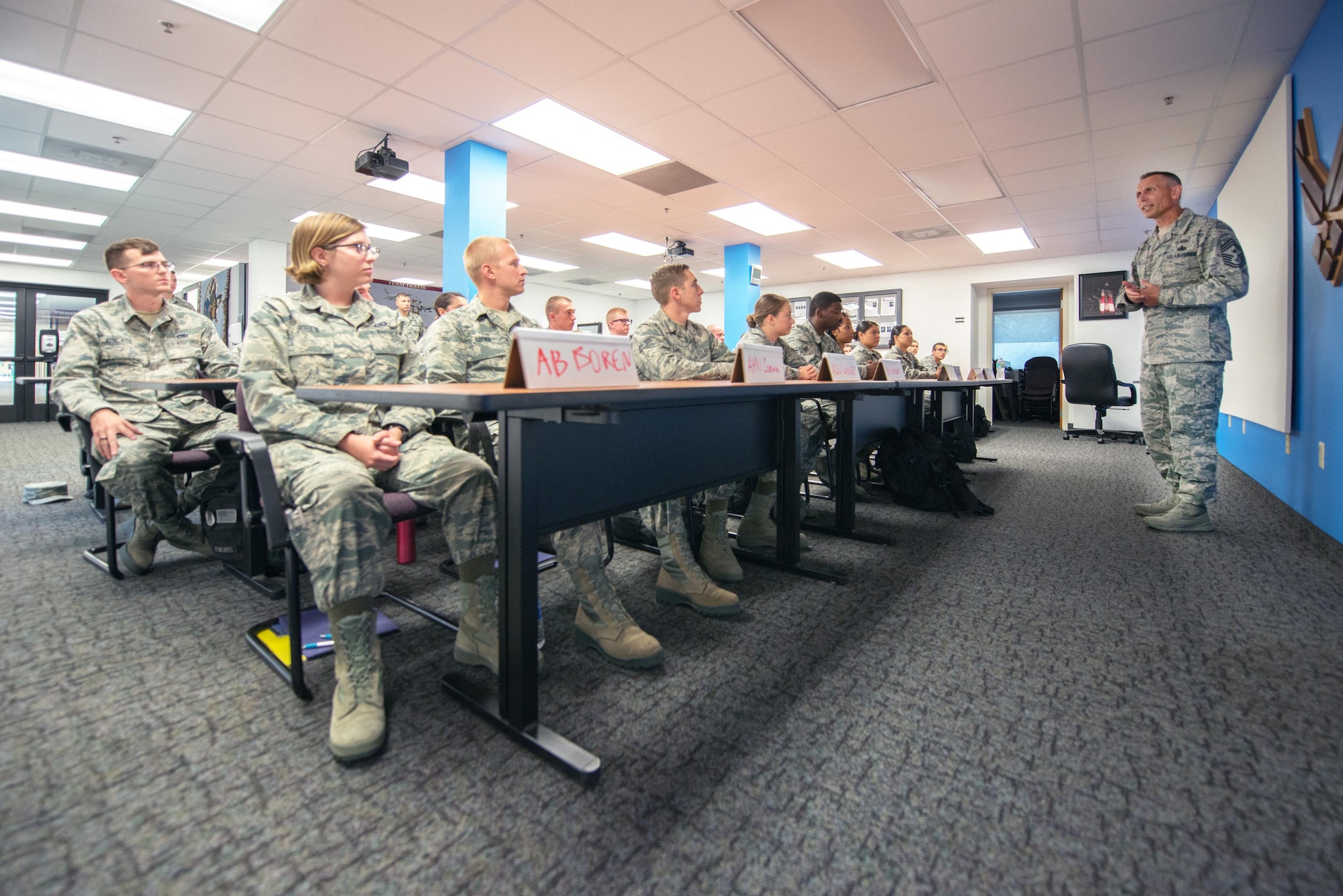 U.S. Air Force Chief Master Sgt. Todd Petzel, 18th Air Force command chief, Scott Air Force Base, Ill., visits the First Term Airman Center at Travis Air Force Base, Calif., Aug. 11, 2016. Petzel visited Travis AFB to provide remarks as the guest speaker for the Senior Non-Commissioned Officer Induction ceremony. (U.S. Air Force photo by Louis Briscese)