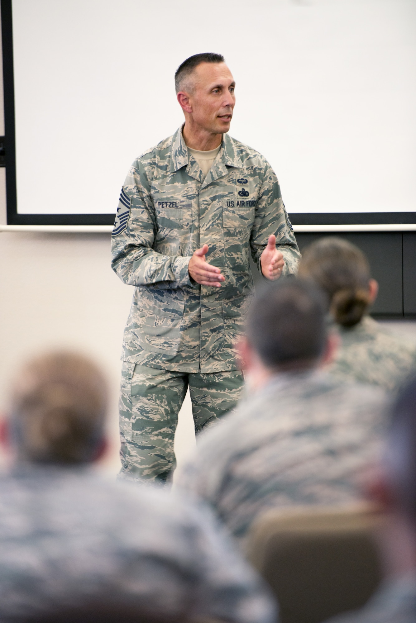 U.S. Air Force Chief Master Sgt. Todd Petzel, 18th Air Force command chief, Scott Air Force Base, Ill., speaks with Airmen during the Senior Non-Commissioned Officer Professional Enhancement Seminar at Travis Air Force Base, Calif., Aug. 11, 2016. Petzel visited Travis AFB to provide remarks as the guest speaker for the Senior Non-Commissioned Officer Induction ceremony. (U.S. Air Force Photo by Louis Briscese)