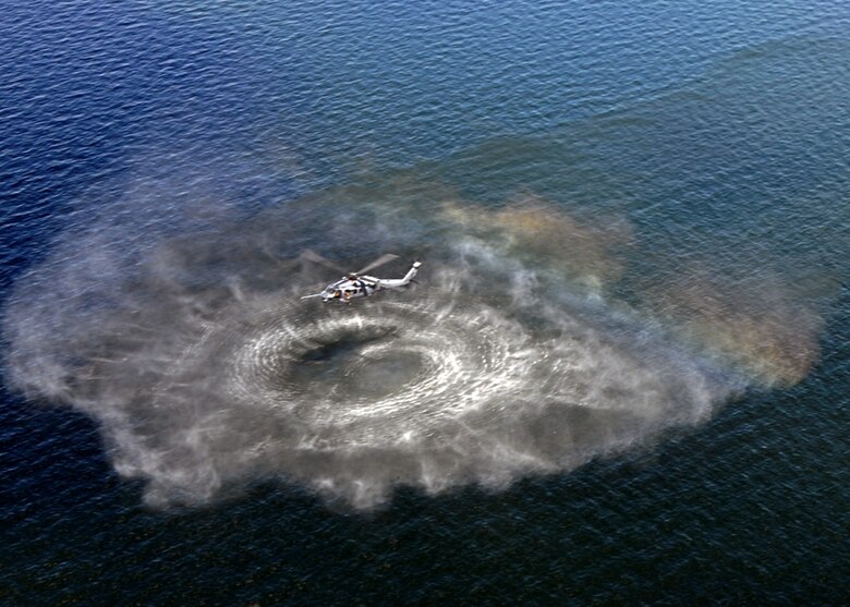 An Air Force Reserve HH-60 from the 305th Rescue Squadron hold a hover during training operations at Lake Champlain, NY, Aug. 7. Approximately 50 Air Force Reserve Airmen from the 943rd Rescue Group at Davis-Monthan Air Force Base, Ariz., deployed for training to the East Coast for joint operations July 31 to Aug 12. (U.S. Air Force photo by Carolyn Herrick)