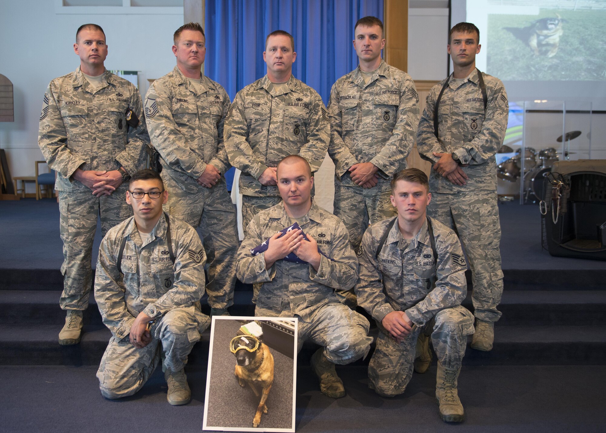 366th Security Forces Squadron working dog handlers pose for a photo after a memorial ceremony for military working dog Vvass Aug. 11, 2016, at Liberty Chapel on Mountain Home Air Force Base, Idaho. Vvass deployed twice as a Gunfighter serving in various locations around the world. (U.S. Air Force photo by Airman 1st Class Chester Mientkiewicz/Released)