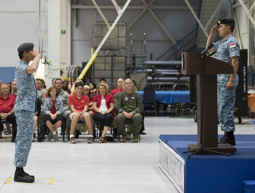 The troop commander of a parade formation salutes Lt. Col. Tham Yeow Min, commander of the Peace Carvin V detachment August 5, 2016 at Mountain Home AFB, Idaho. The Republic of Singapore Air Force has had a detachment stationed at Mountain Home AFB since May 16, 2009. (U.S. Air Force photo by Airman Alaysia Berry/Released)