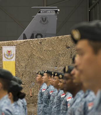 Singaporean service members of the 428th Fighter Squadron stand in formation August 5, 2016, at Mountain Home AFB, Idaho. The squadron’s mission is to provide advanced weapons and tactics continuation training for Singapore’s military. (U.S. Air Force photo by 2nd Lt. Kippun Sumner/Released)
