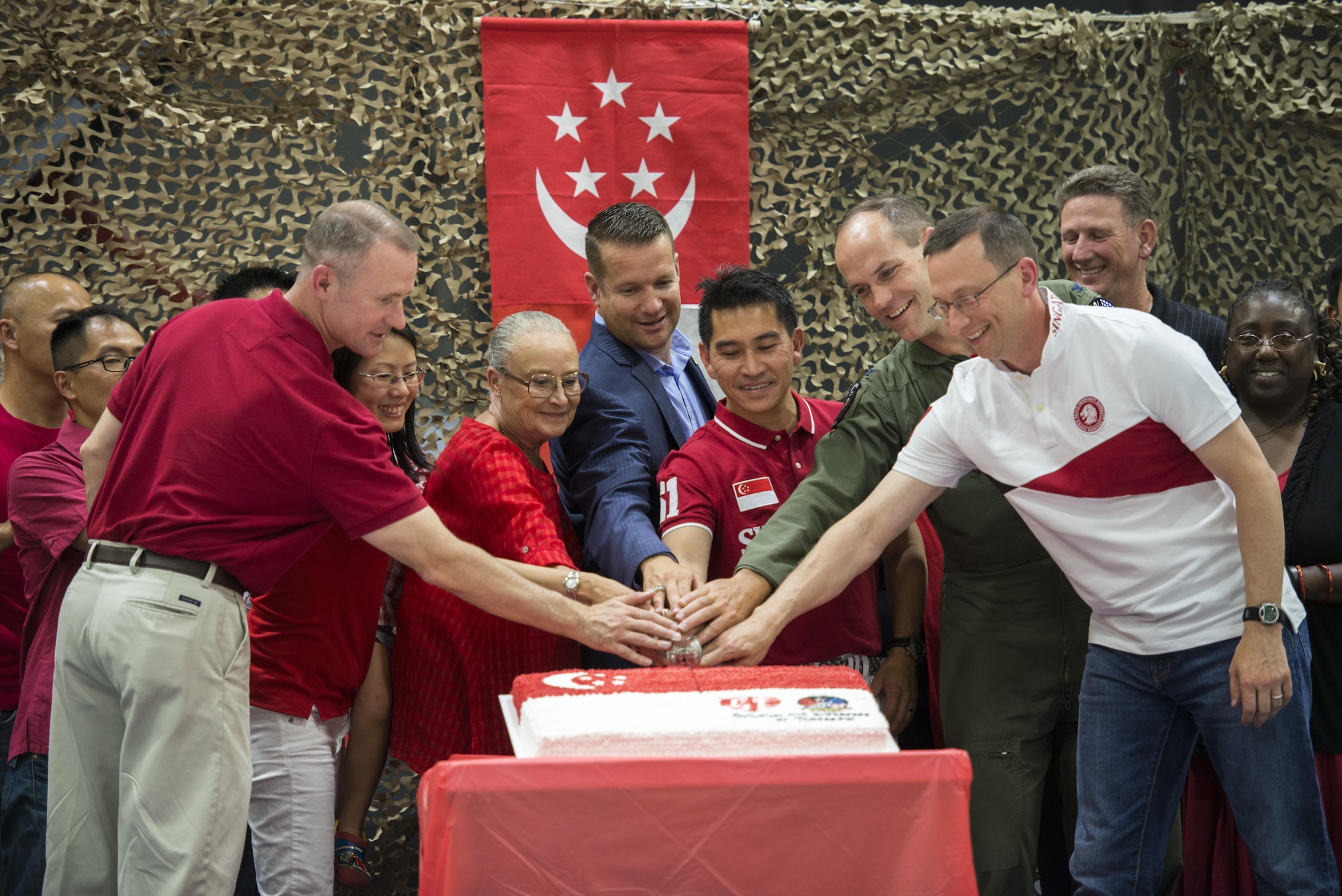 Mountain Home military and civic leaders assist in the cutting of the birthday cake in celebration of Singapore’s 51st birthday August 5, 2016, at Mountain Home AFB, Idaho. Singapore celebrated 51 years of independence August 9, 2016. (U.S. Air Force photo by 2nd Lt. Kippun Sumner/Released)