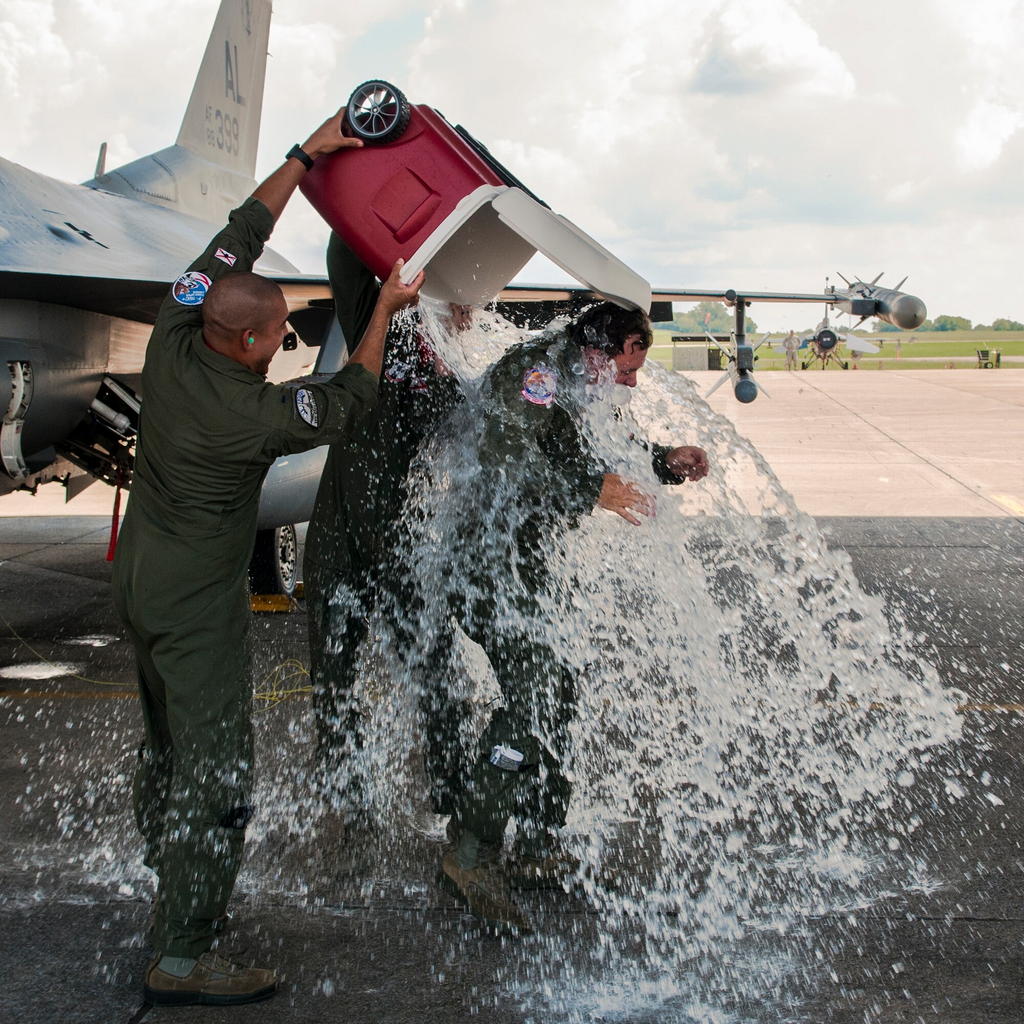 U.S. Air Force Col. Clarence “Ski” Borowski gets iced water dumped on him after his “fini flight” Aug. 7, 2016, on the flightline at Montgomery Regional Air National Guard Base, Ala. Borowski relinquished command of the 187th Operations Group in a change of command ceremony earlier that day. (U.S. Air National Guard photo by Staff Sgt. Jared Rand)