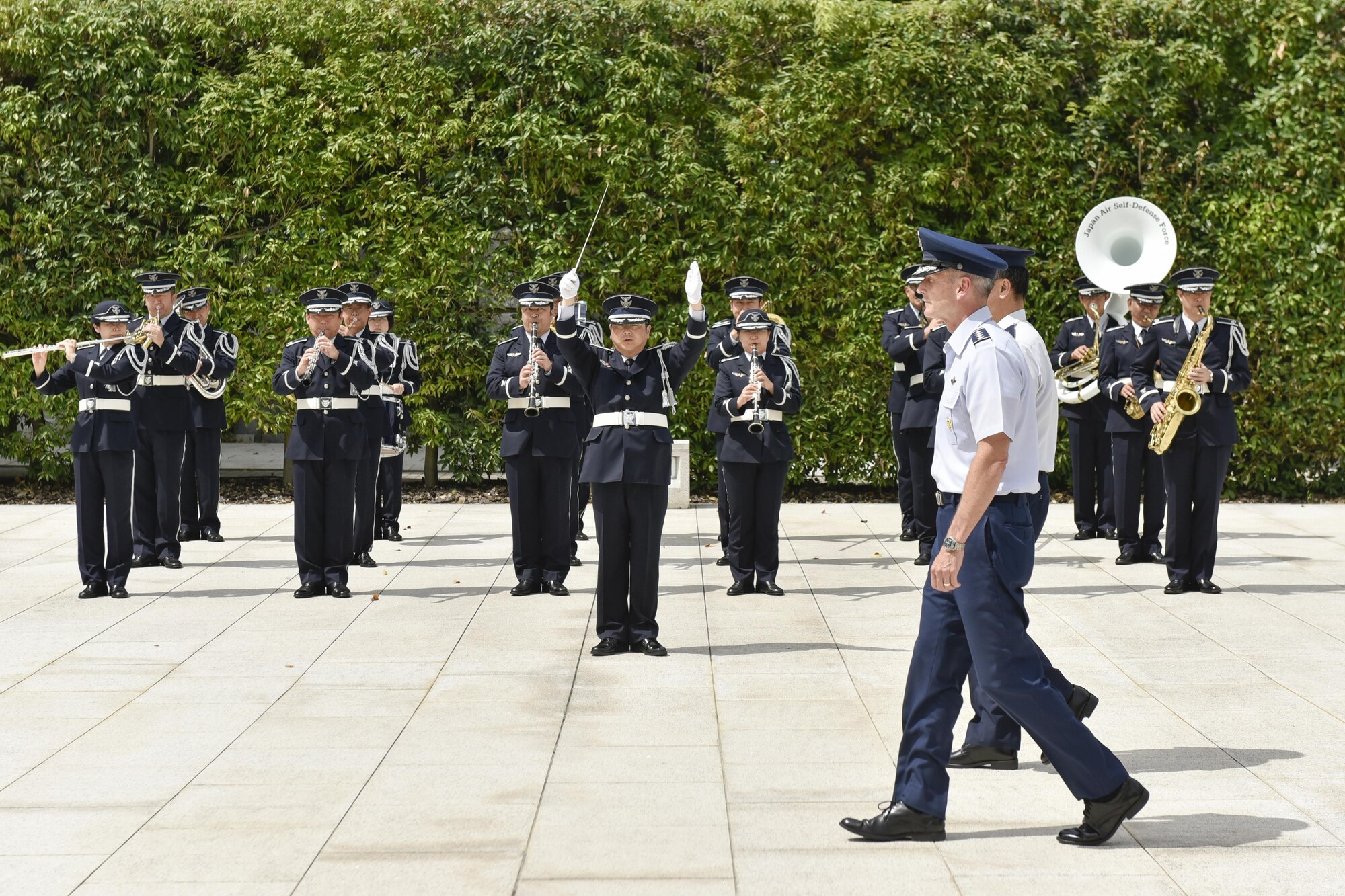 U.S. Air Force Gen. Terrence J. O’Shaughnessy, Pacific Air Forces commander, walks past Japan Air Self-Defense Force band members during a wreath laying ceremony at the Japanese Ministry of Defense during his first trip to Tokyo as COMPACAF, Japan, Aug. 8, 2016. During his tour, O’Shaughnessy visited and met with Airmen and with dignitaries at the Japan Air Staff Office, Air Defense Command, U.S. Embassy and Japan’s Ministry of Defense. O’Shaughnessy is also visiting other installations throughout the Indo-Asia Pacific Region. (U.S. Air Force photo by Staff Sgt. Michael Washburn)

