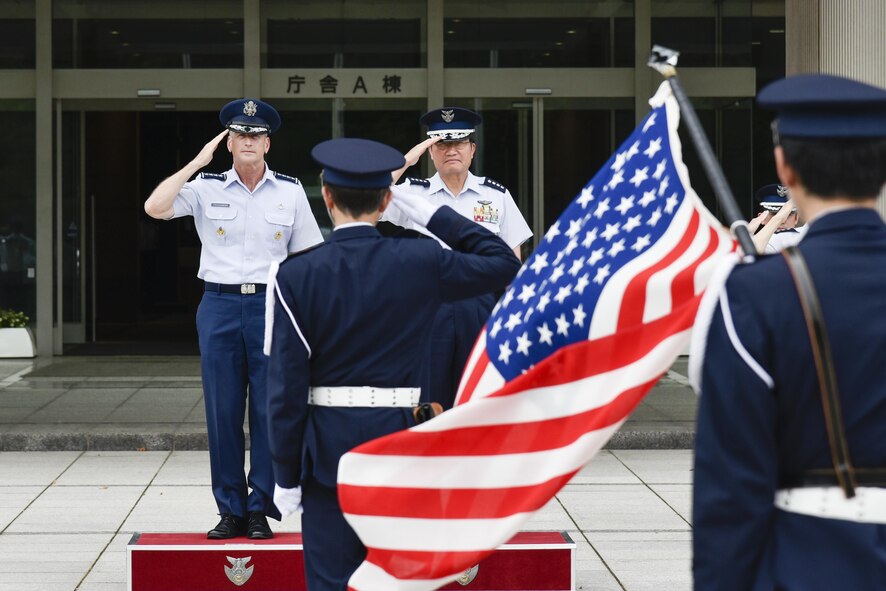 U.S. Air Force Gen. Terrence J. O’Shaughnessy, Pacific Air Forces commander, and Japan Air Self-Defense Force Gen. Yoshiyuki Sugiyama, chief of staff, salute the American and Japanese flag (not pictured) during an honor guard ceremony at Japan’s Ministry of Defense in Tokyo, Japan, Aug. 8, 2016, during his first trip as COMPACAF in the Indo-Asia-Pacific region. For the first time since taking command of PACAF, O’Shaughnessy visited the Japan Air Staff Office, Air Defense Command, U.S. Embassy and Yokota Air Base, Japan. (U.S. Air Force photo by Staff Sgt. Michael Washburn)